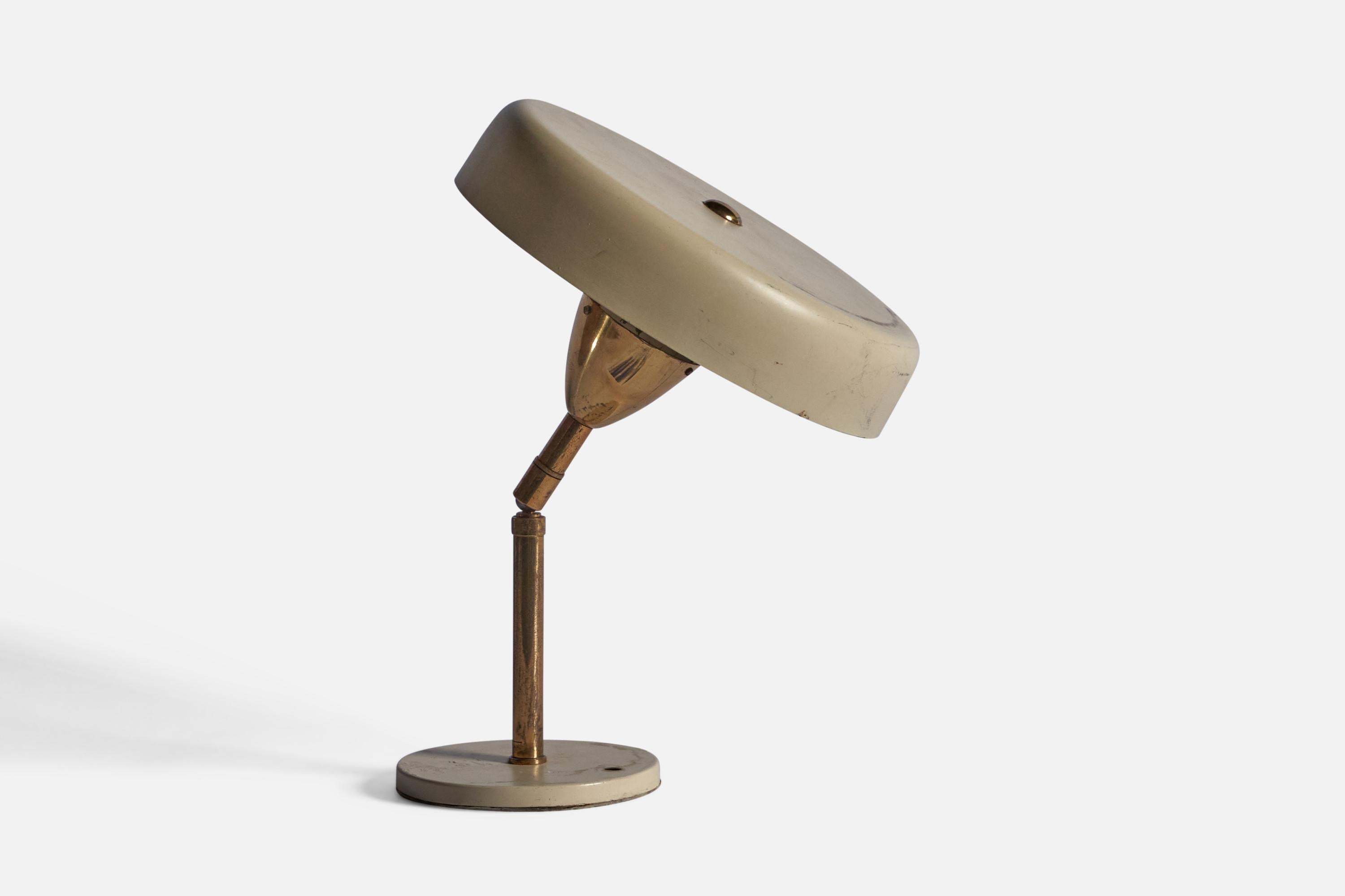 A brass and cream-lacquered table lamp, designed and produced in Italy, c. 1940s.