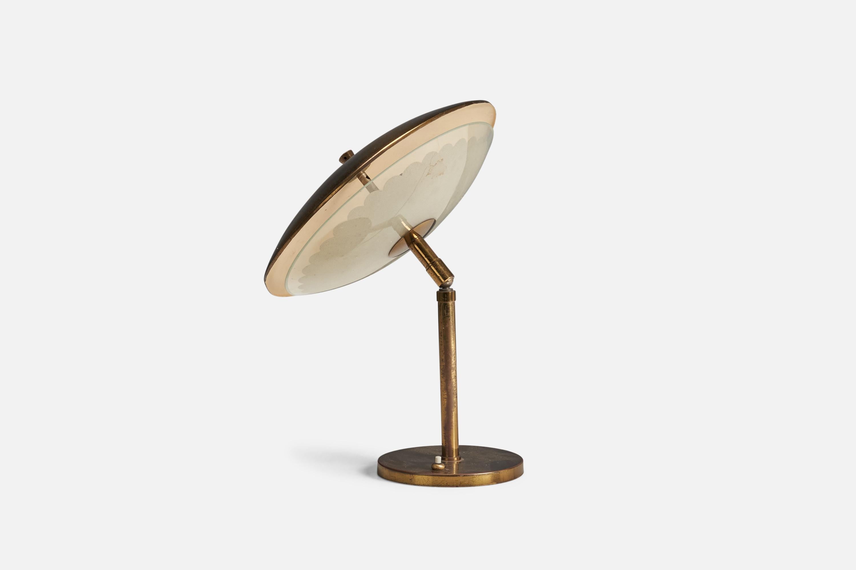 An adjustable glass and brass table lamp designed and produced by an Italian Designer, Italy, 1940s.

Dimensions variable, measured as illustrated in upright position.

Sockets take E-14 bulbs.

There is no maximum wattage stated on the
