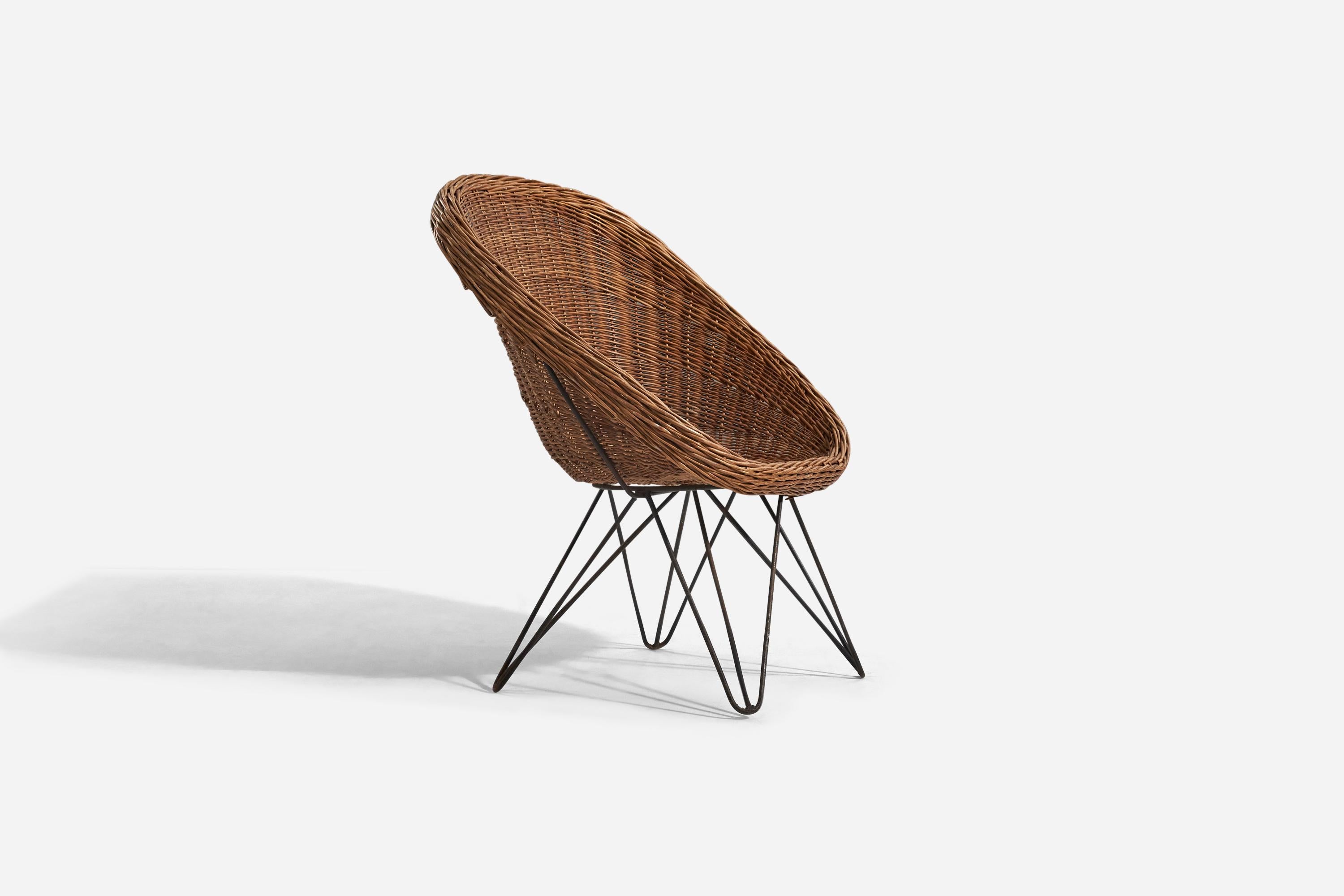 Silla de mimbre y metal diseñada y fabricada en Italia, años 50.
