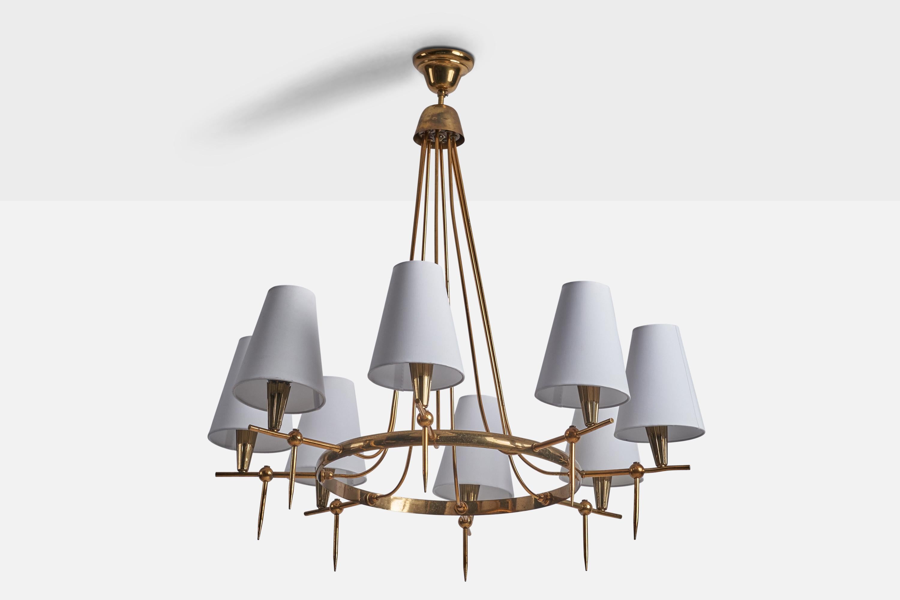 A brass and white fabric chandelier designed and produced in Italy, c. 1950s.

Overall Dimensions (inches): 32.5” H x 31” Diameter
Back Plate Dimensions (inches): 4” Diameter
Bulb Specifications: E-12 Bulb
Number of Sockets: 8
All lighting will be