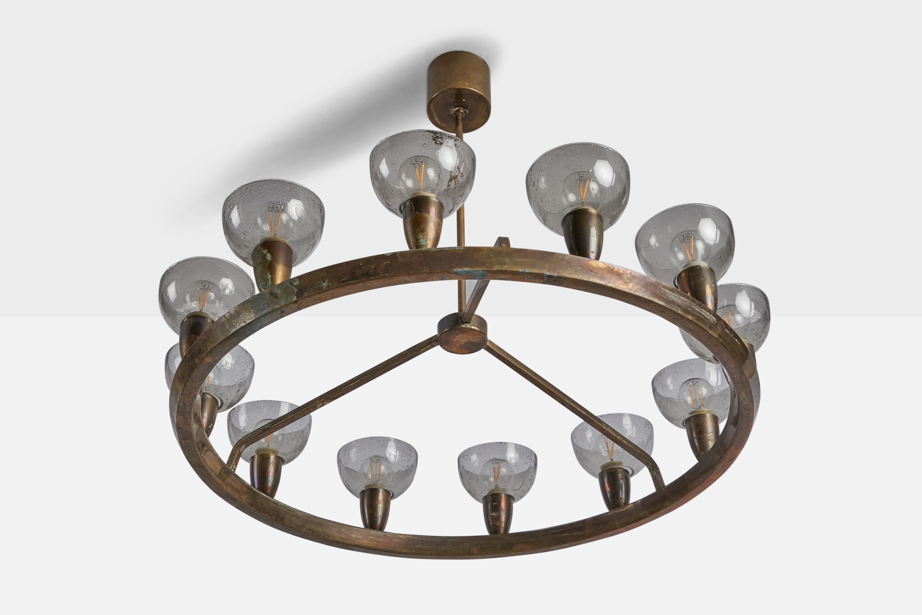 A blown glass and brass chandelier designed and produced in Italy, c. 1940s.

Overall Dimensions (inches): 21.5” H x 28.5” Diameter
Bulb Specifications: E-14 Bulb
Number of Sockets: 12
