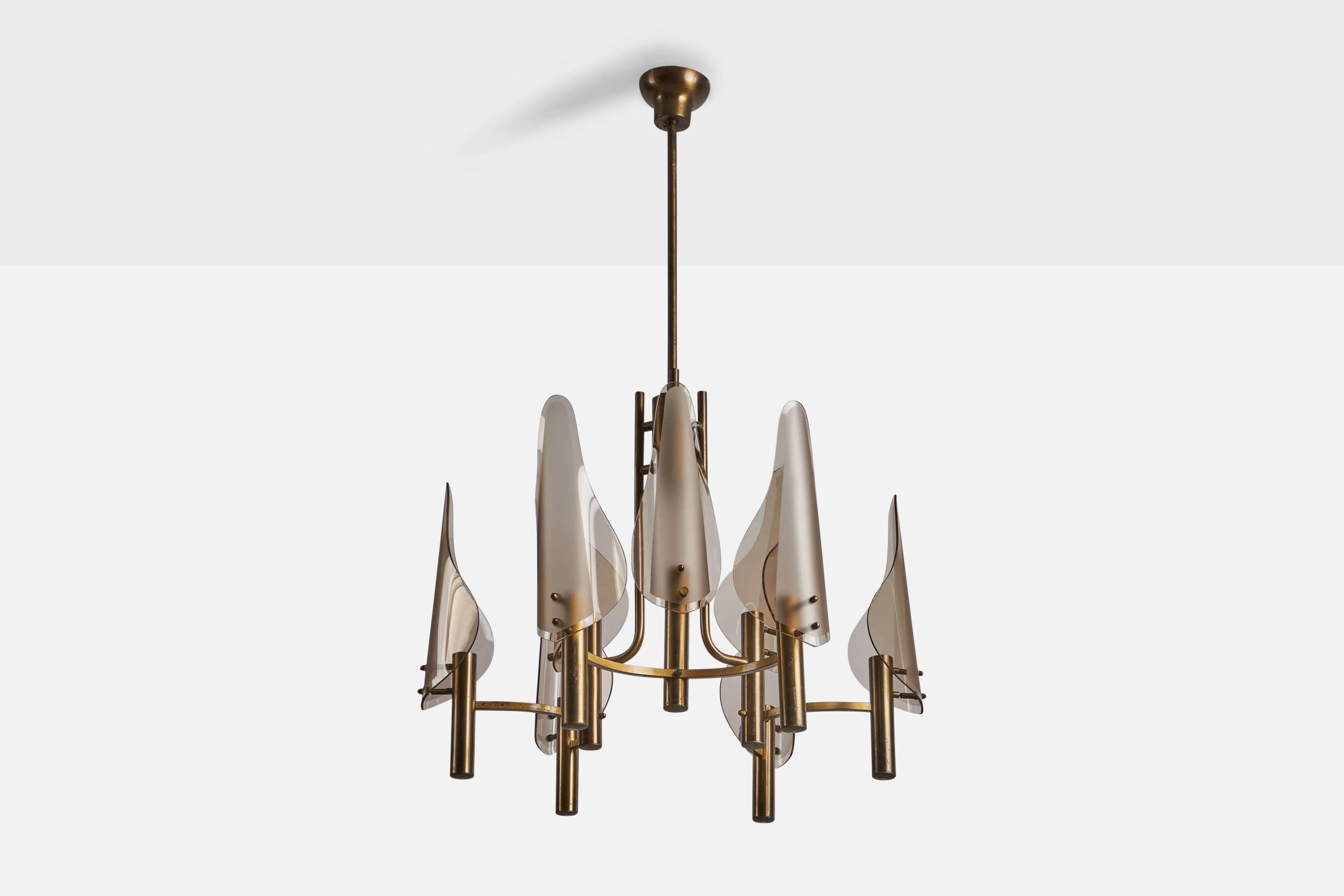 A nine-armed brass and smoked glass chandelier designed and produced in Italy, 1960s.

Overall Dimensions (inches): 39” H x 24” Diameter
Bulb Specifications: E-14 Bulb
Number of Sockets: 9