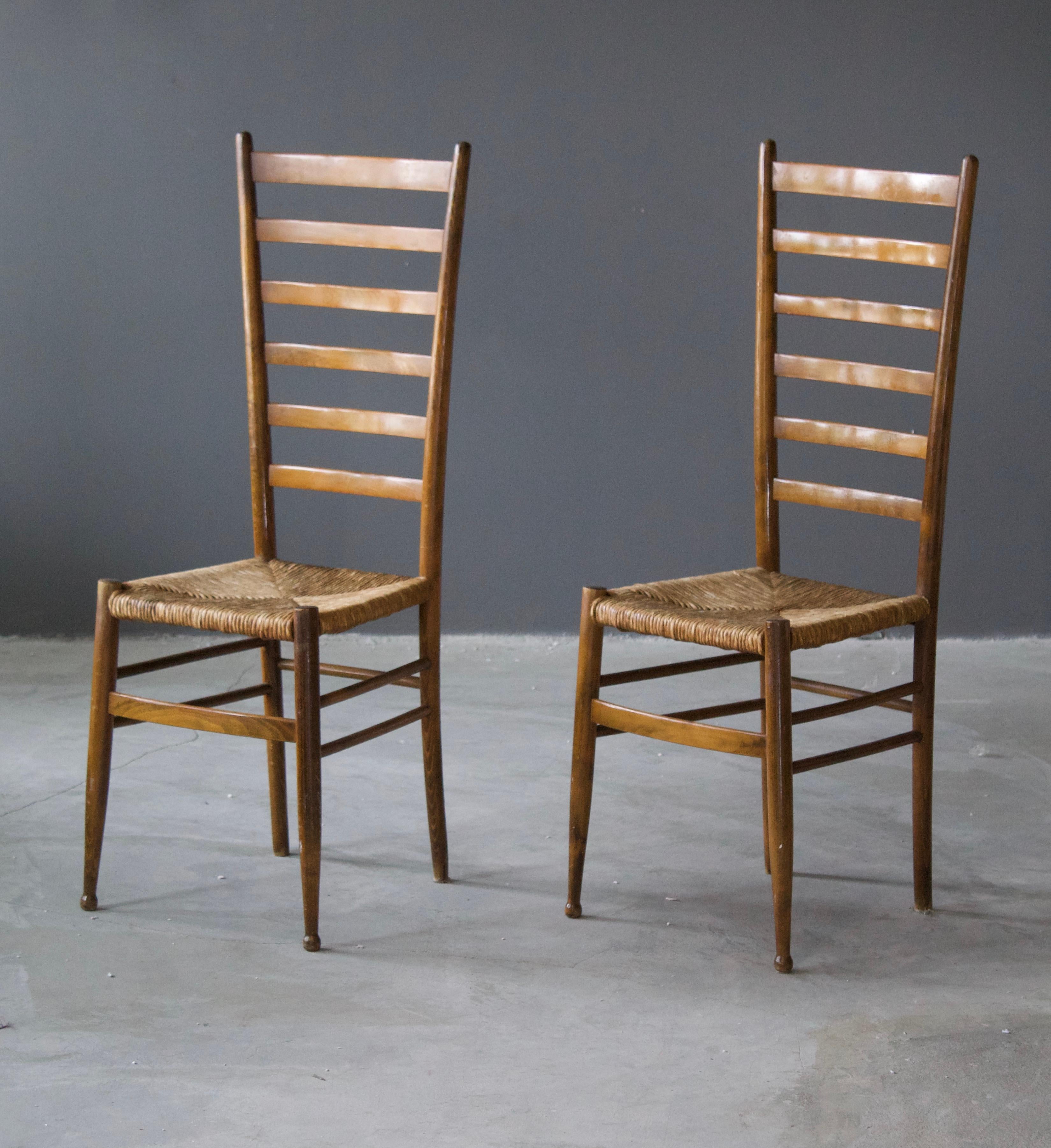 A pair of Chiavari style side chairs, designed and produced in Italy, circa 1950s.