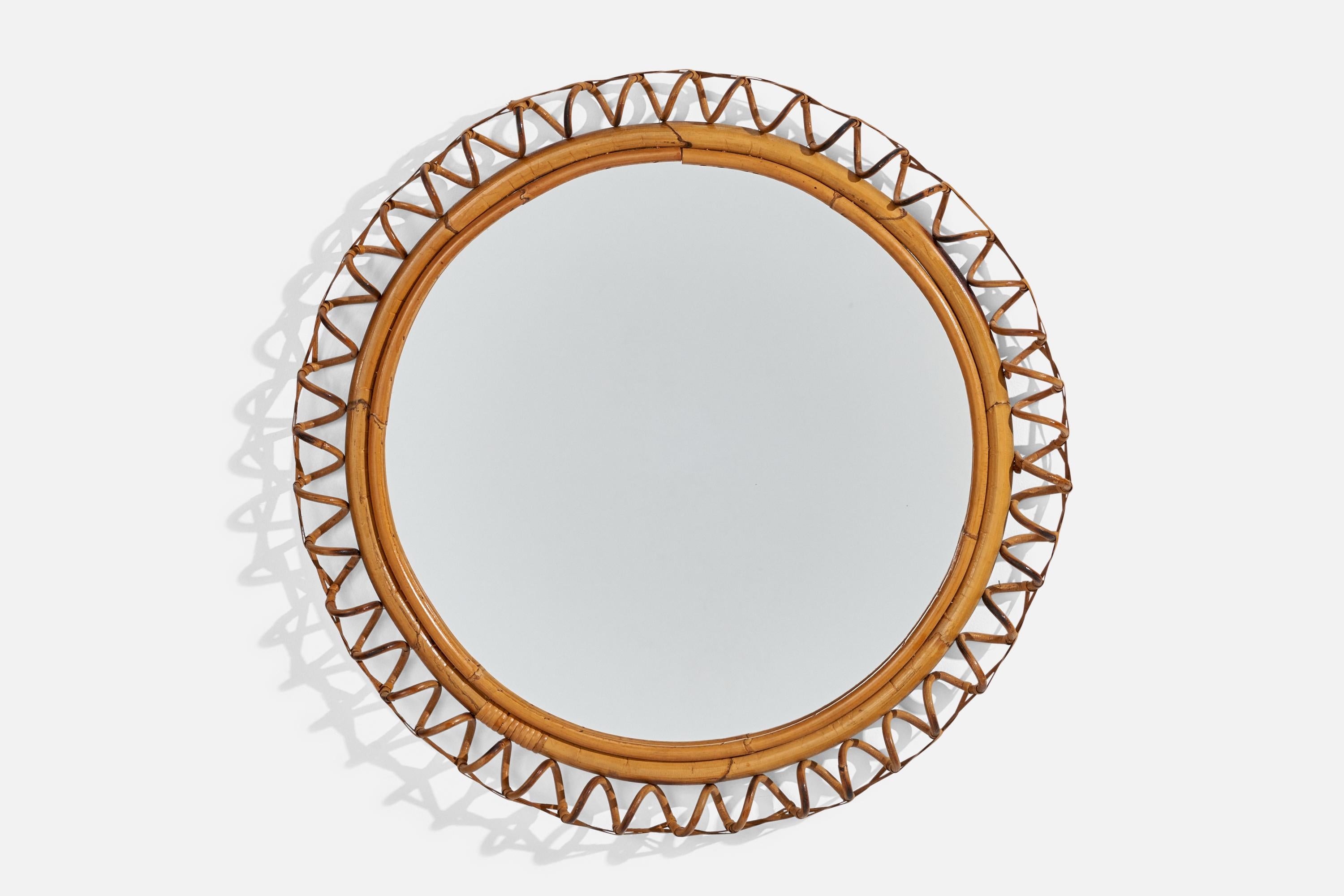 A circular, rattan and bamboo wall mirror designed and produced by an Italian designer, Italy, 1950s-1960s.
   