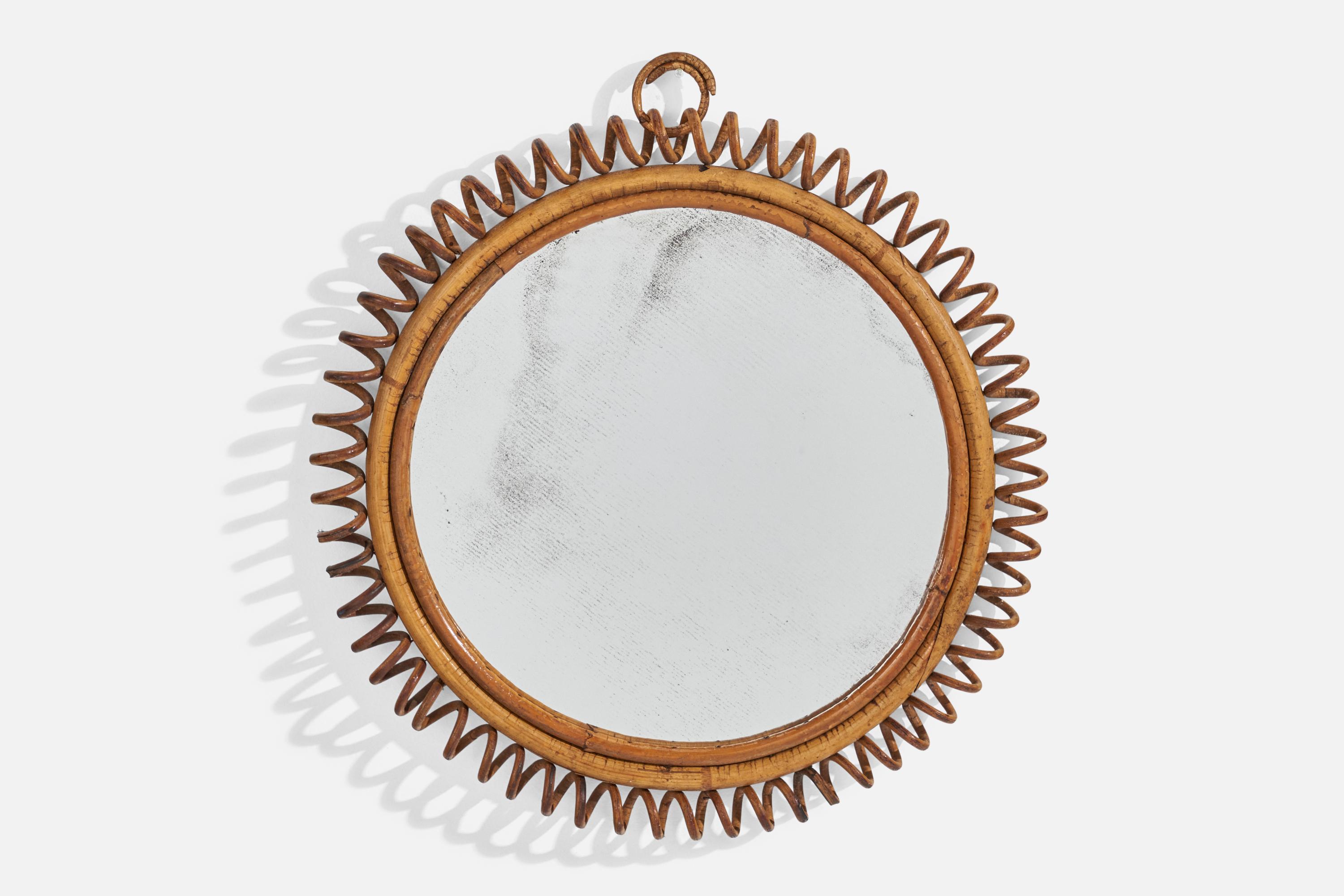 A circular, rattan wall mirror designed and produced by an Italian designer, Italy, 1950s-1960s.
 