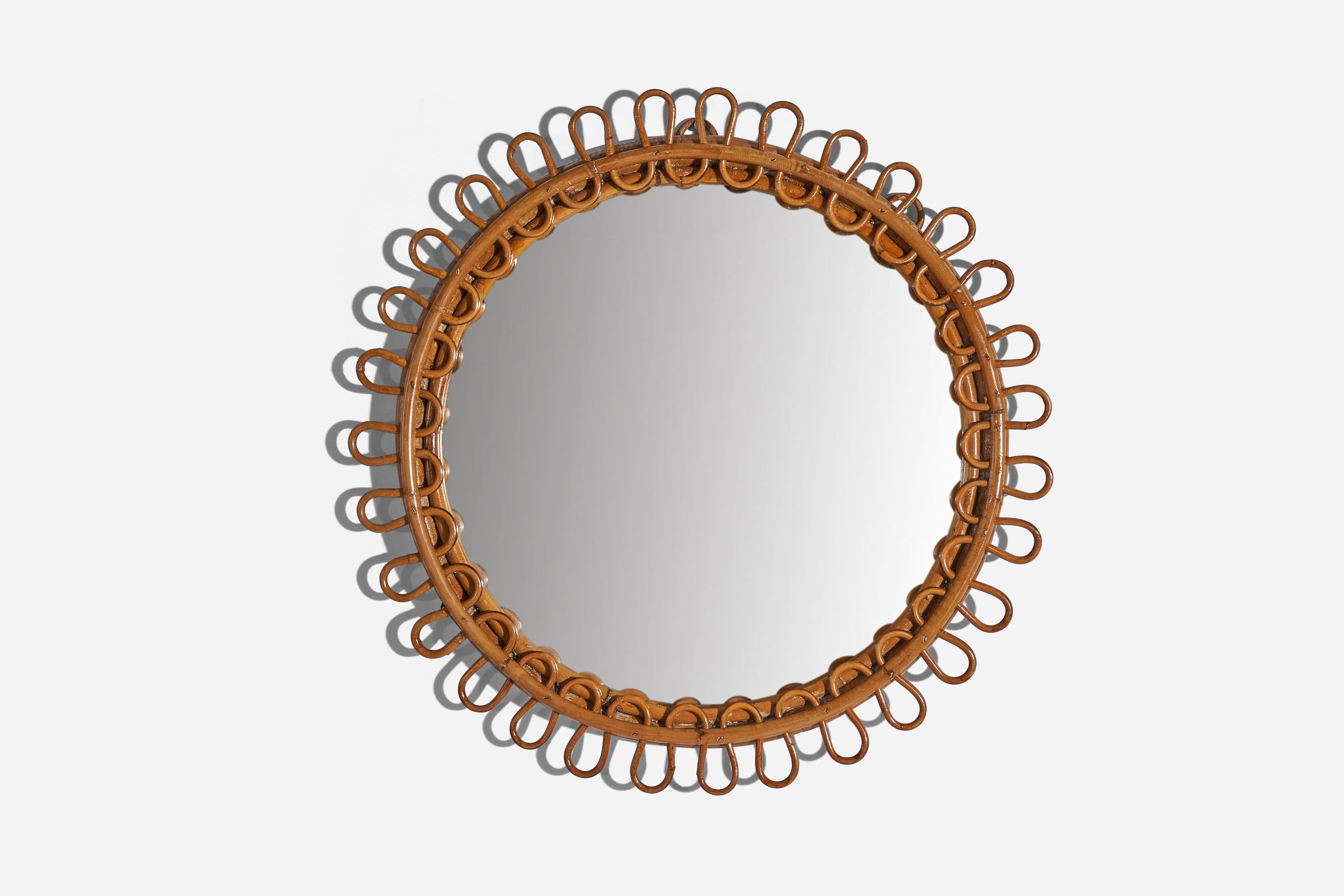 A circular, rattan wall mirror designed and produced by an Italian designer, Italy, 1950s-1960s.
 