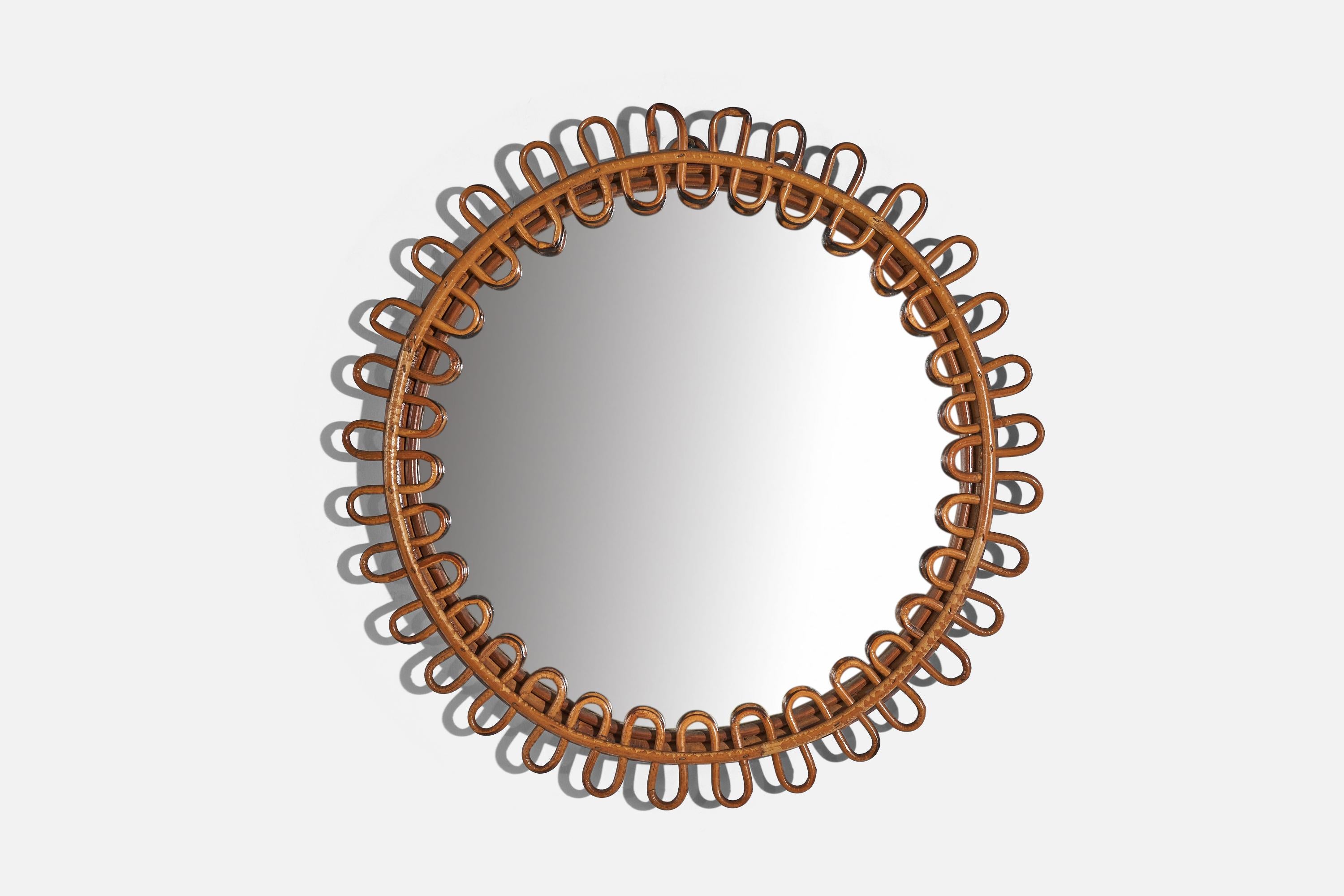 A circular, rattan wall mirror designed and produced by an Italian designer, Italy, 1950s-1960s.
    