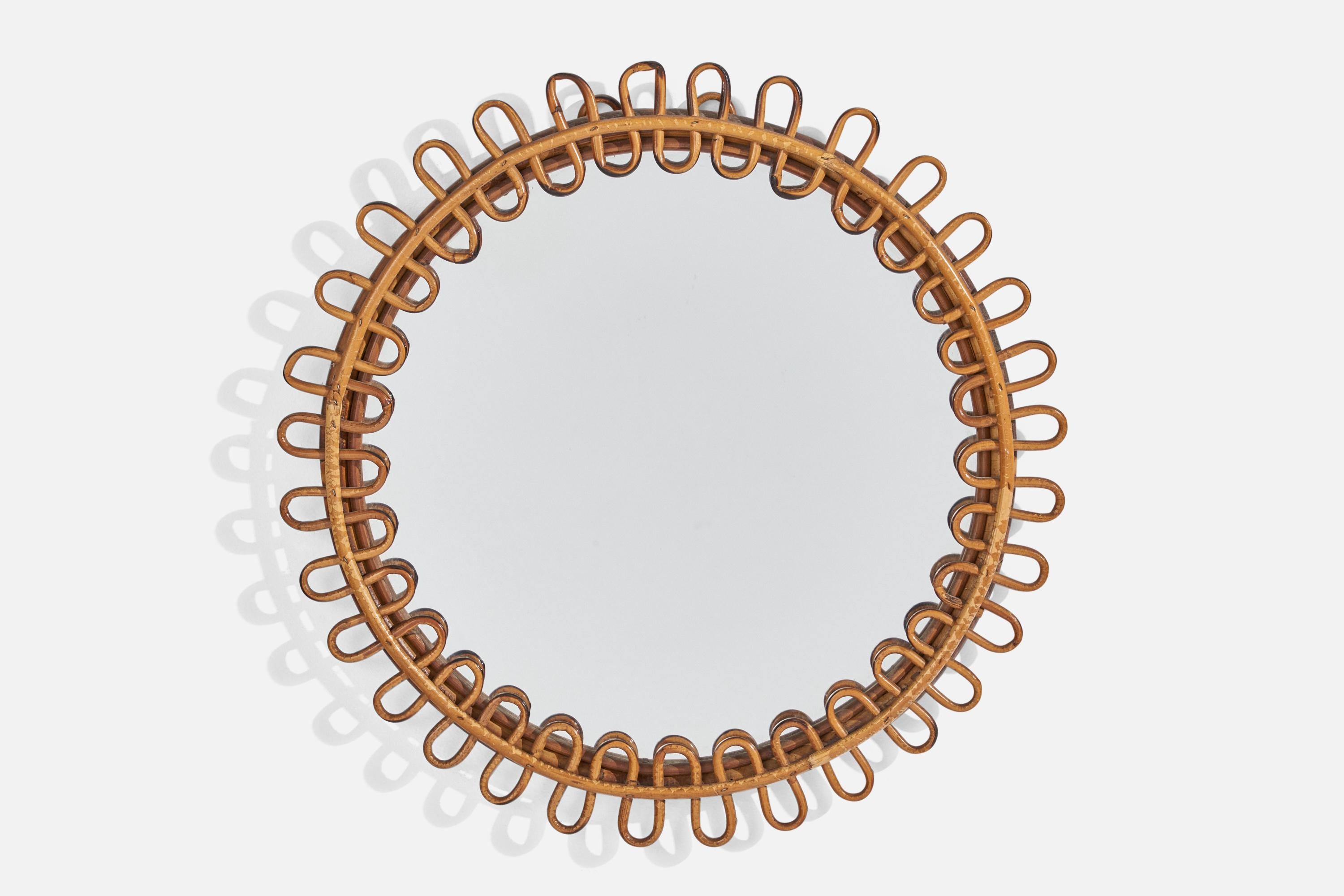 A circular, rattan wall mirror designed and produced by an Italian designer, Italy, 1950s-1960s.
    