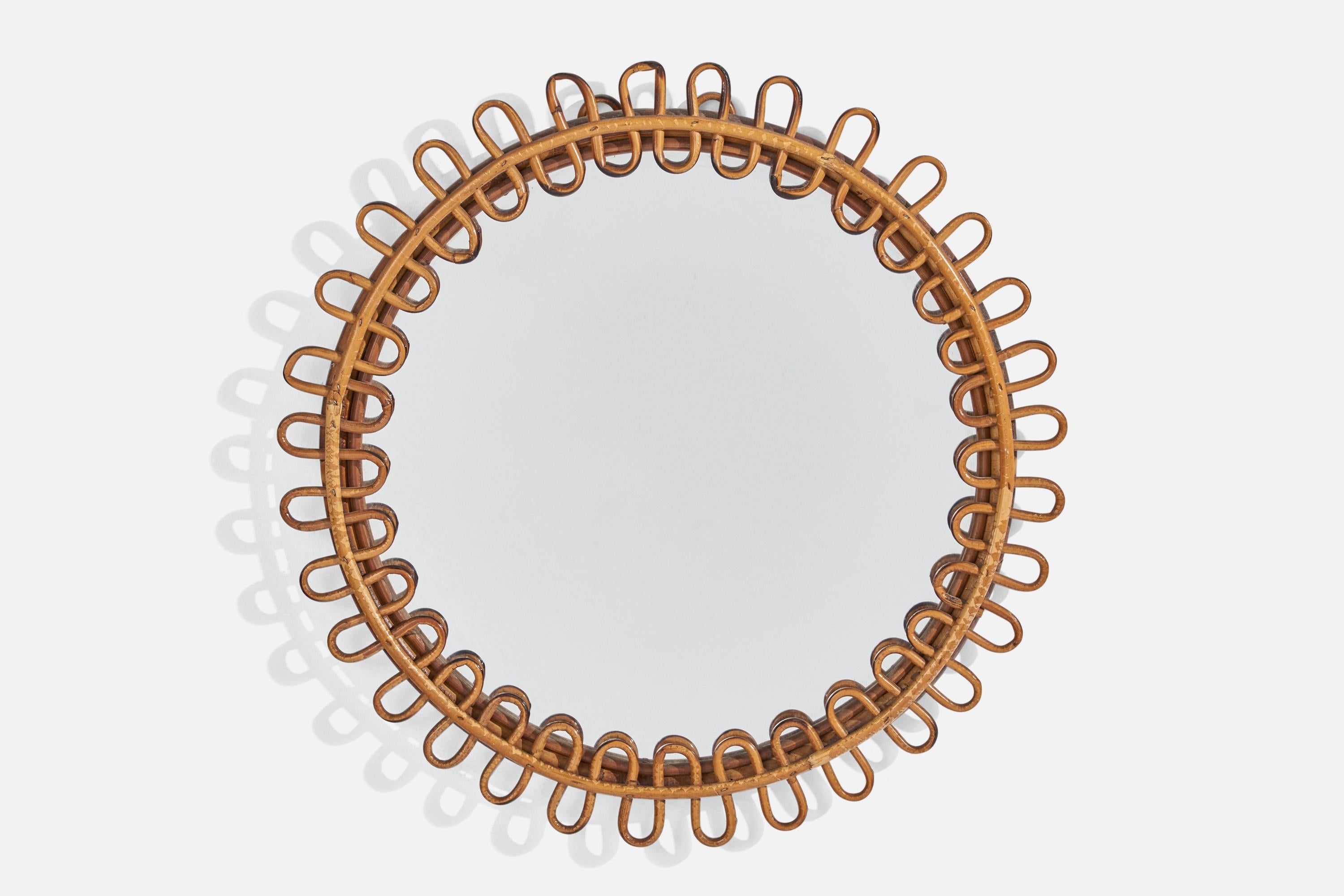 Un miroir mural circulaire en rotin conçu et produit par un designer italien, Italie, années 1950-1960.
    