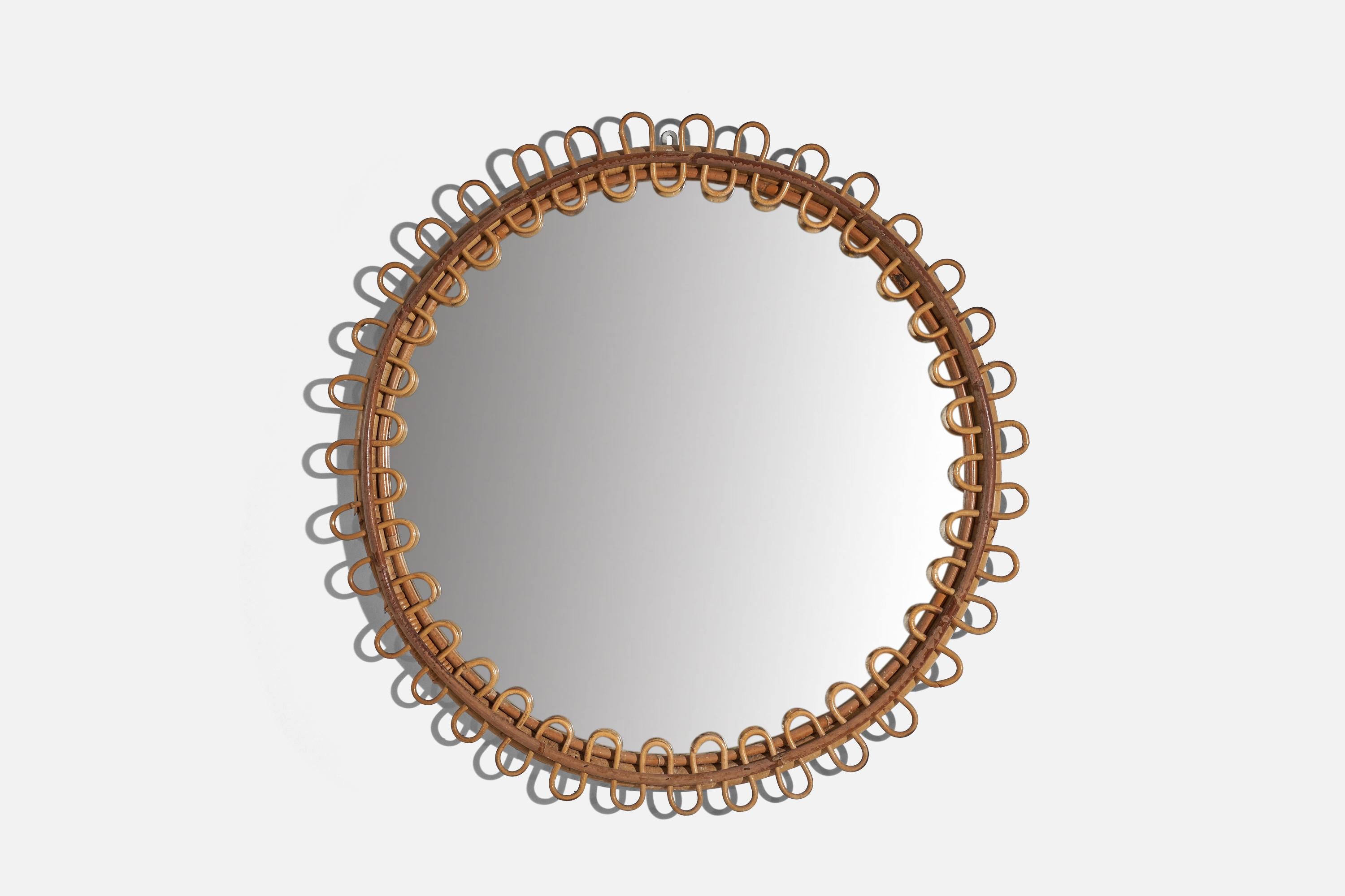 A circular, rattan wall mirror designed and produced by an Italian designer, Italy, 1950s-1960s.
 