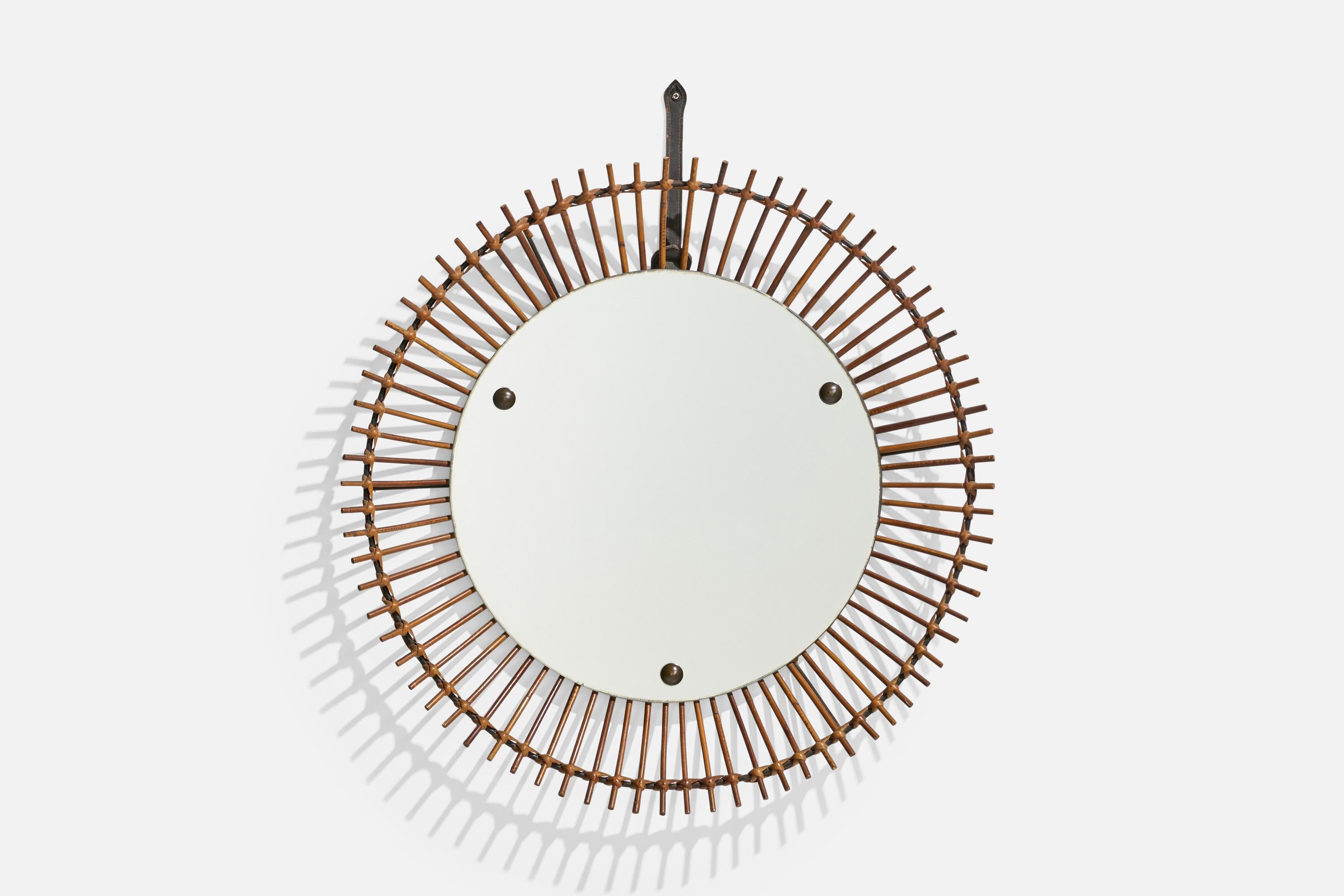 A circular, rattan wall mirror designed and produced by an Italian designer, Italy, 1950s-1960s.
 