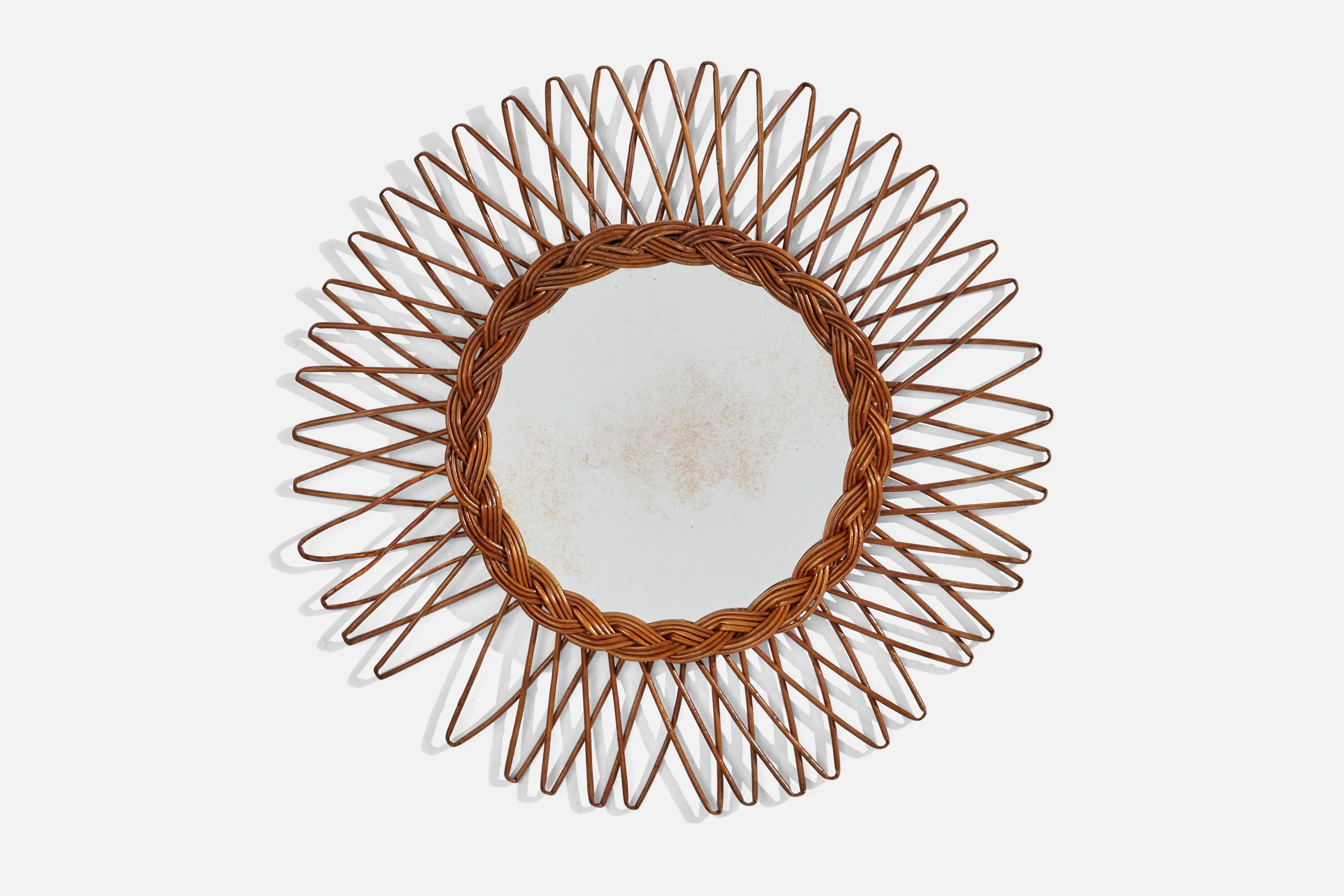 A circular, rattan wall mirror designed and produced by an Italian designer, Italy, 1950s-1960s.
   