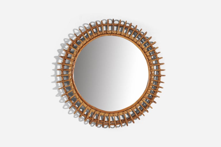 A circular, rattan wall mirror designed and produced by an Italian designer, Italy, 1950s-1960s.
 