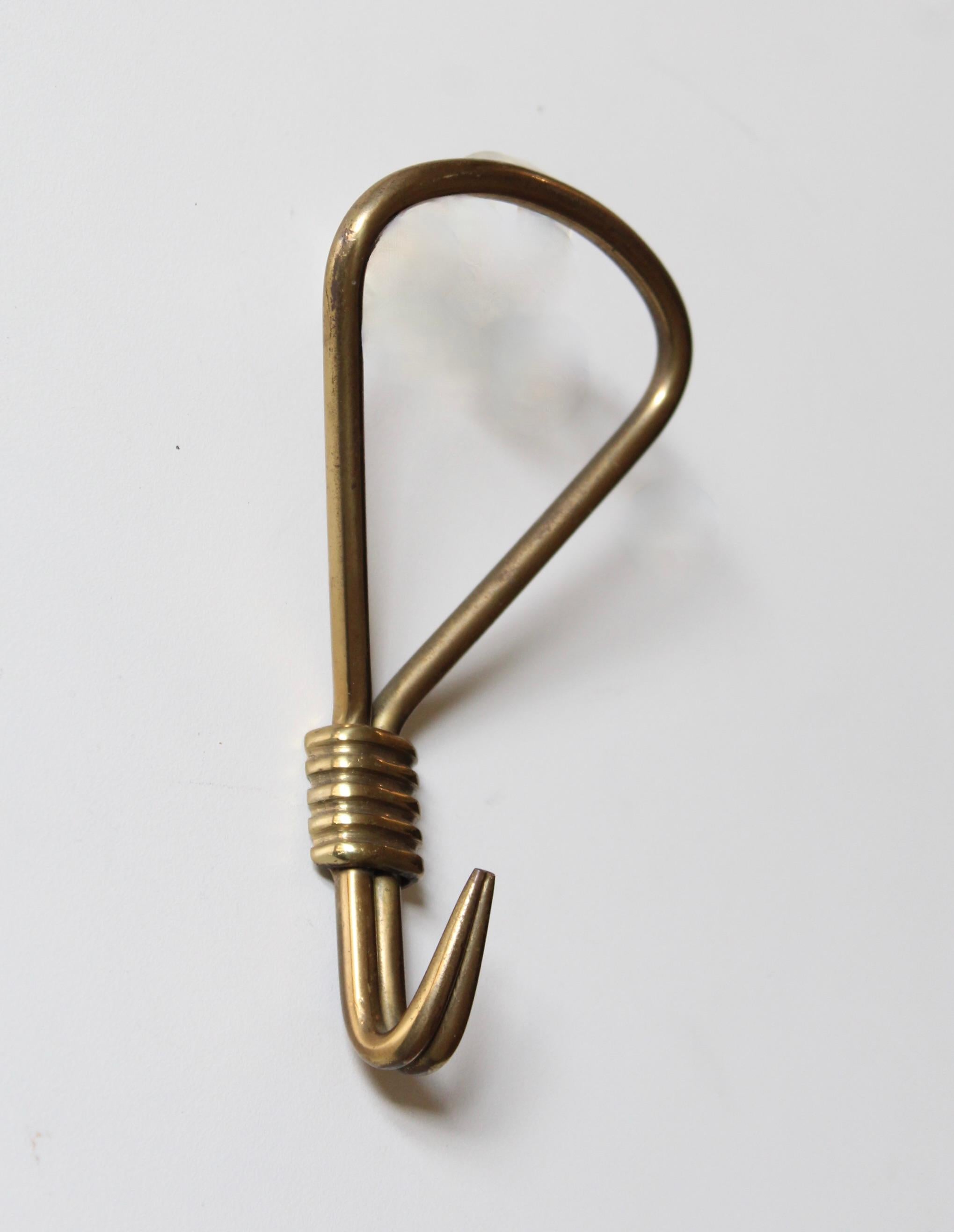 A brass coat hanger designed and produced in Italy, 1940s.