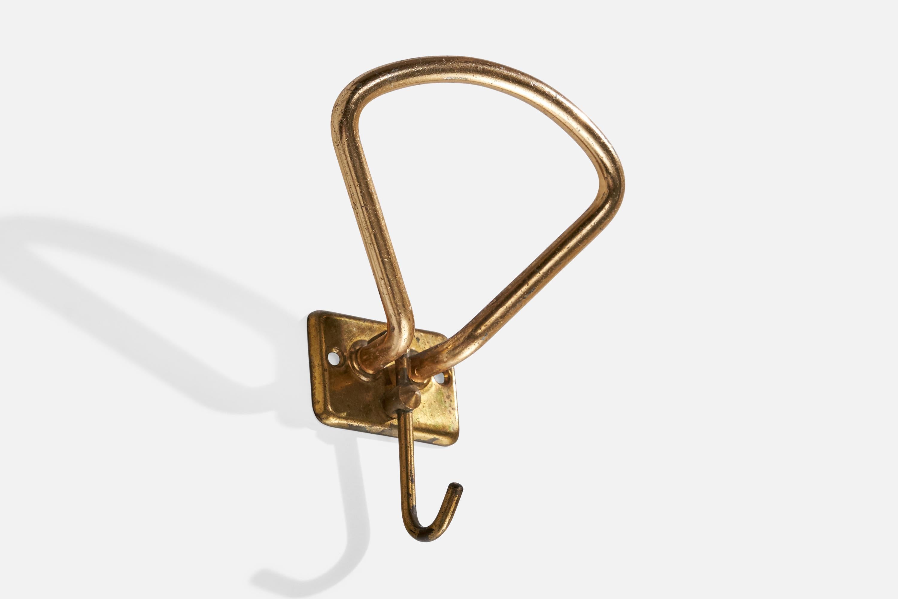 A brass coat hanger designed and produced in Italy, c. 1940s.

Dimensions: 5.25” H x 4” W x 2.5