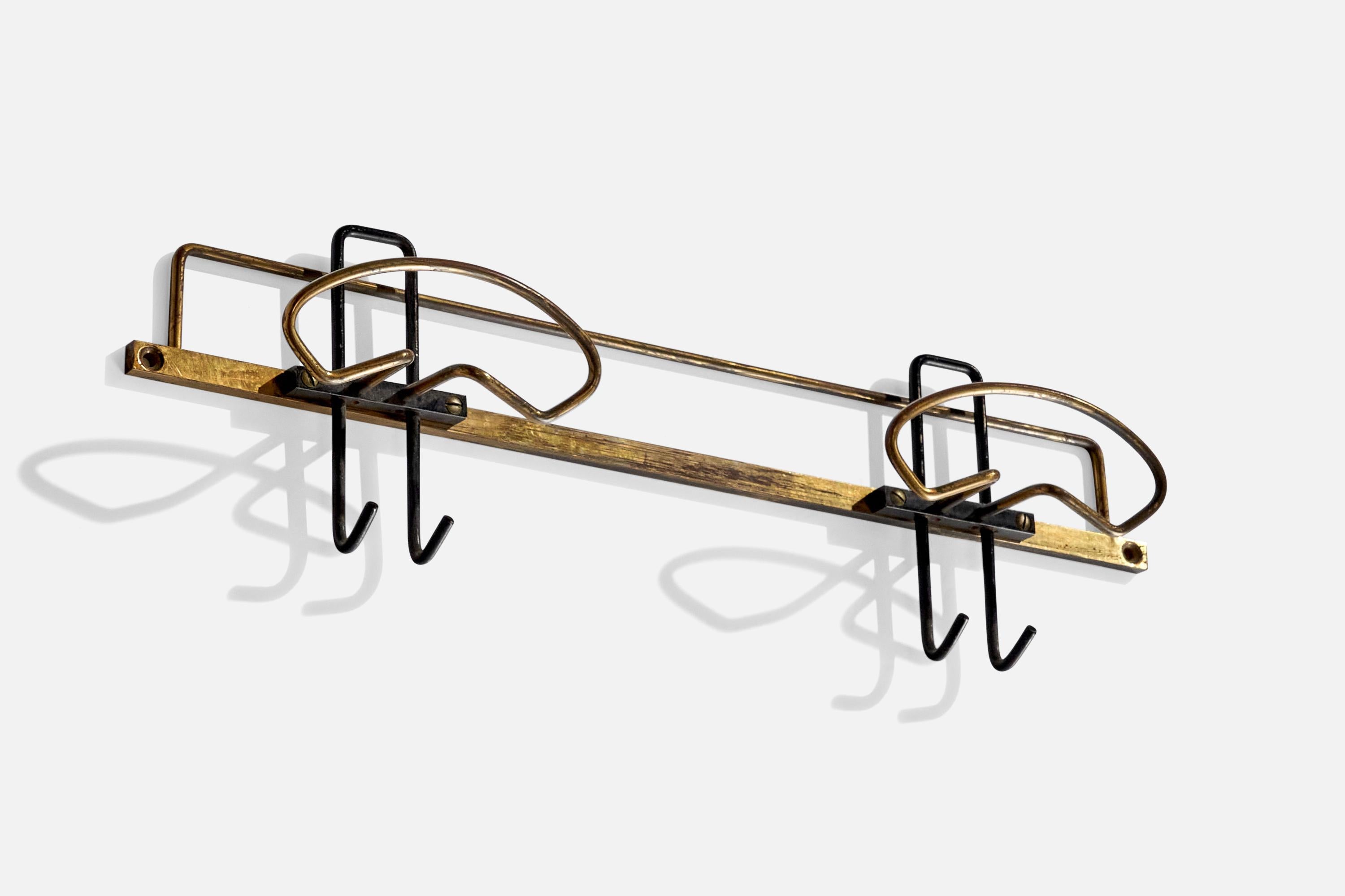 A brass coat hanger designed and produced by an Italian designer, Italy, 1950s.

Dimensions of back plate (inches) : (1.78 x 15.56 x .18).
