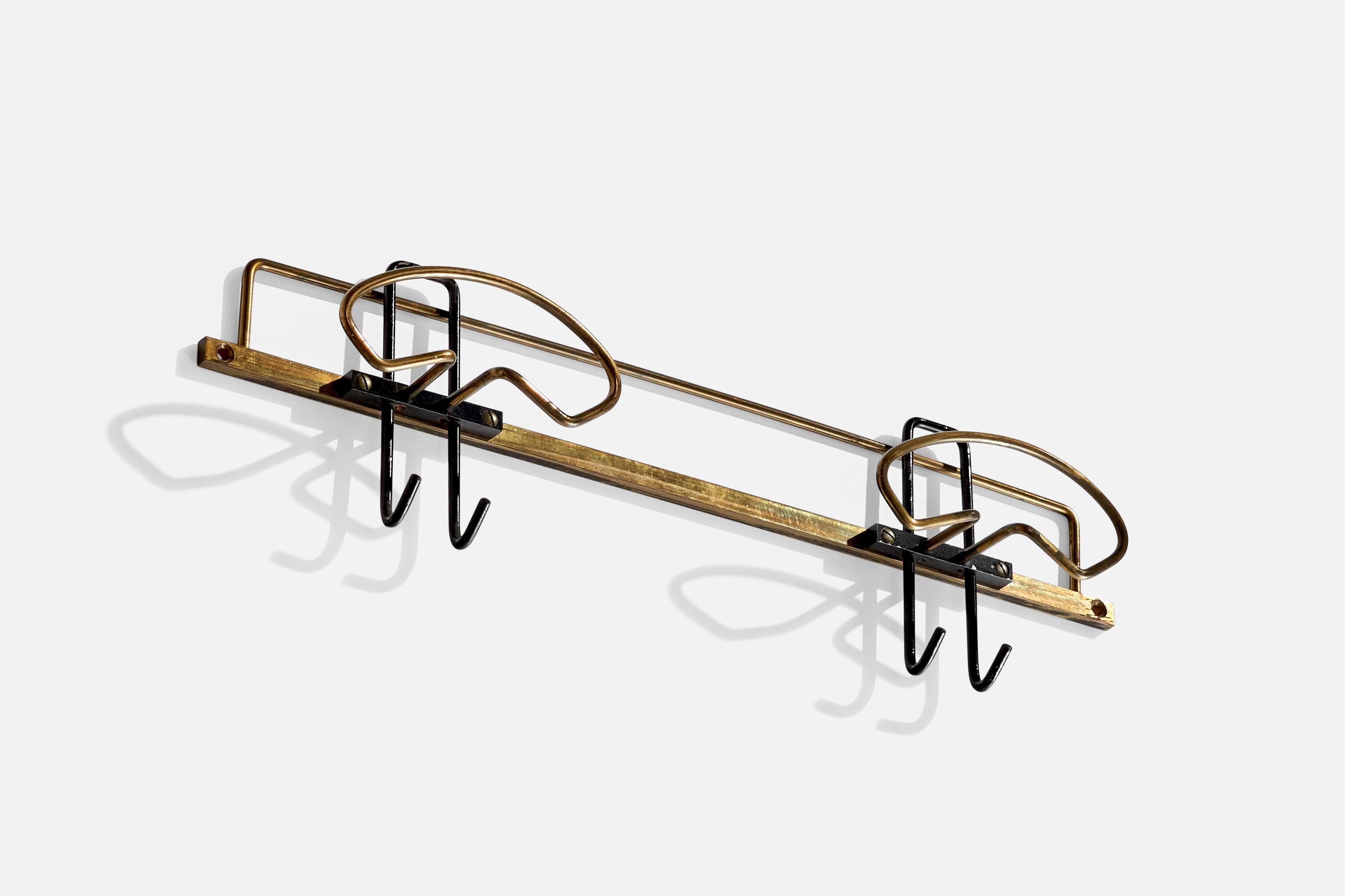 A brass coat hanger designed and produced by an Italian designer, Italy, 1950s.

Dimensions of back plate (inches) : (1.78 x 15.56 x .18).
