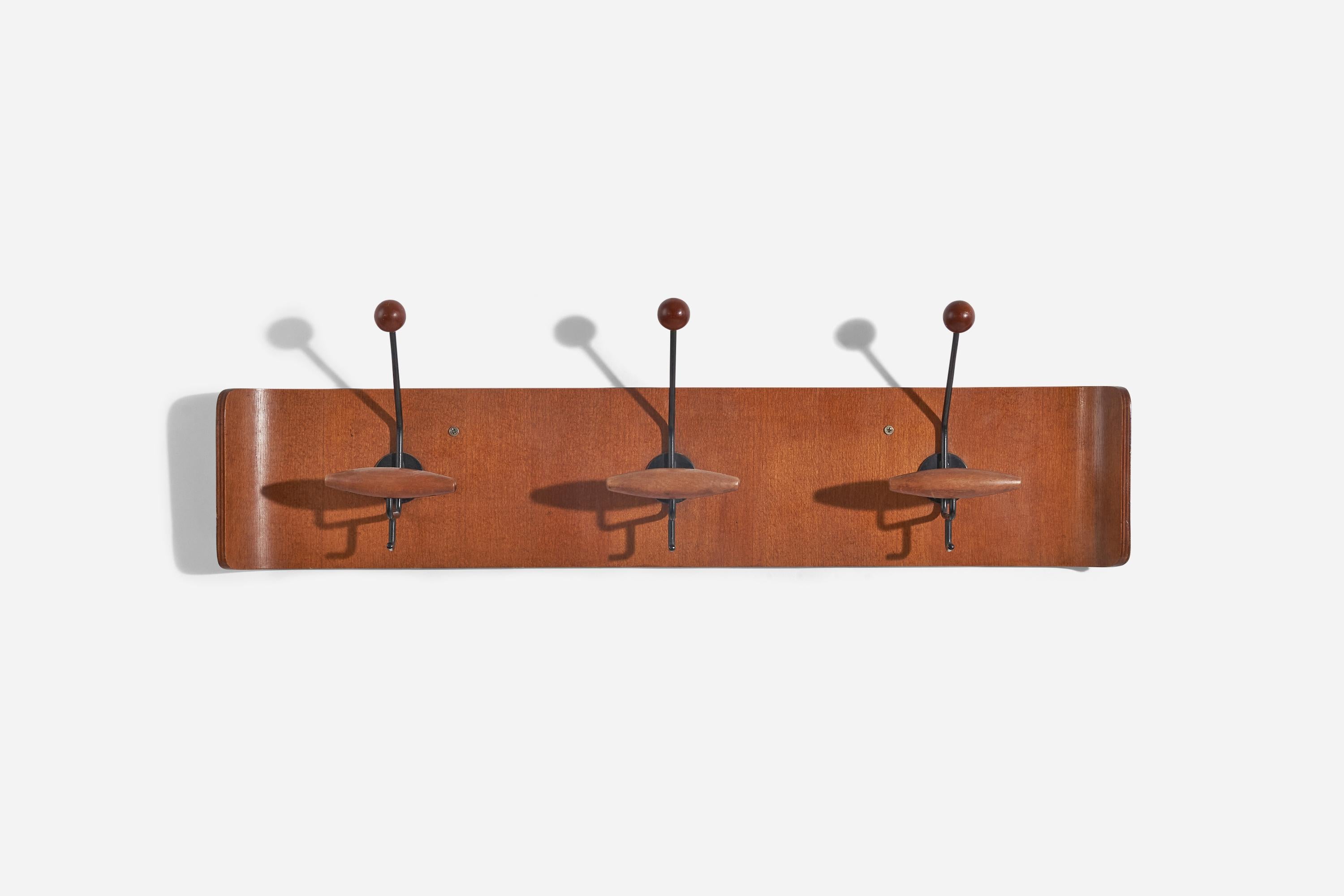 A teak and metal coat hanger designed and produced by an Italian designer, Italy, 1950s.
 