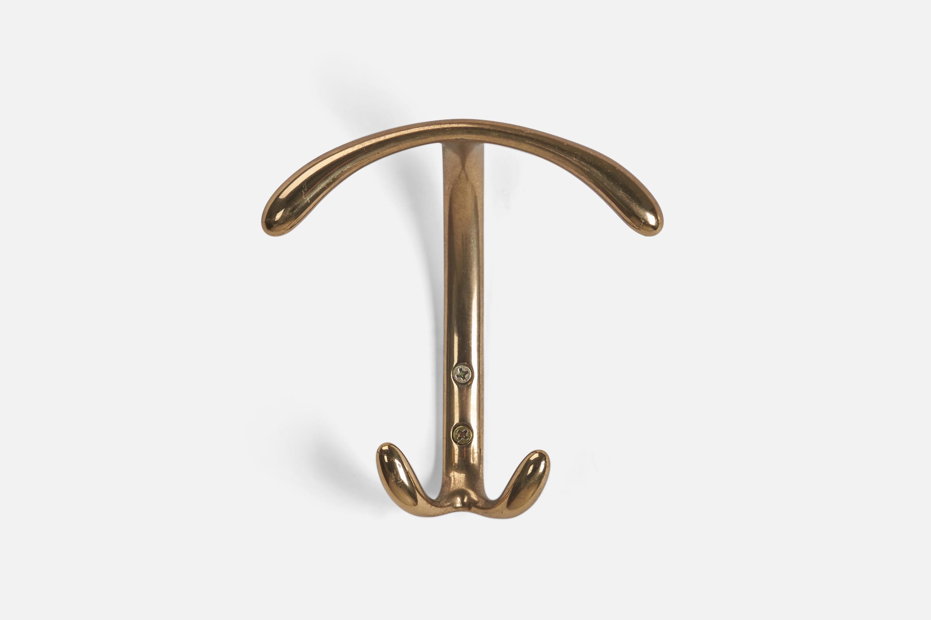 A set of brass coat hangers designed and produced by an Italian Designer, Italy, 1960s.