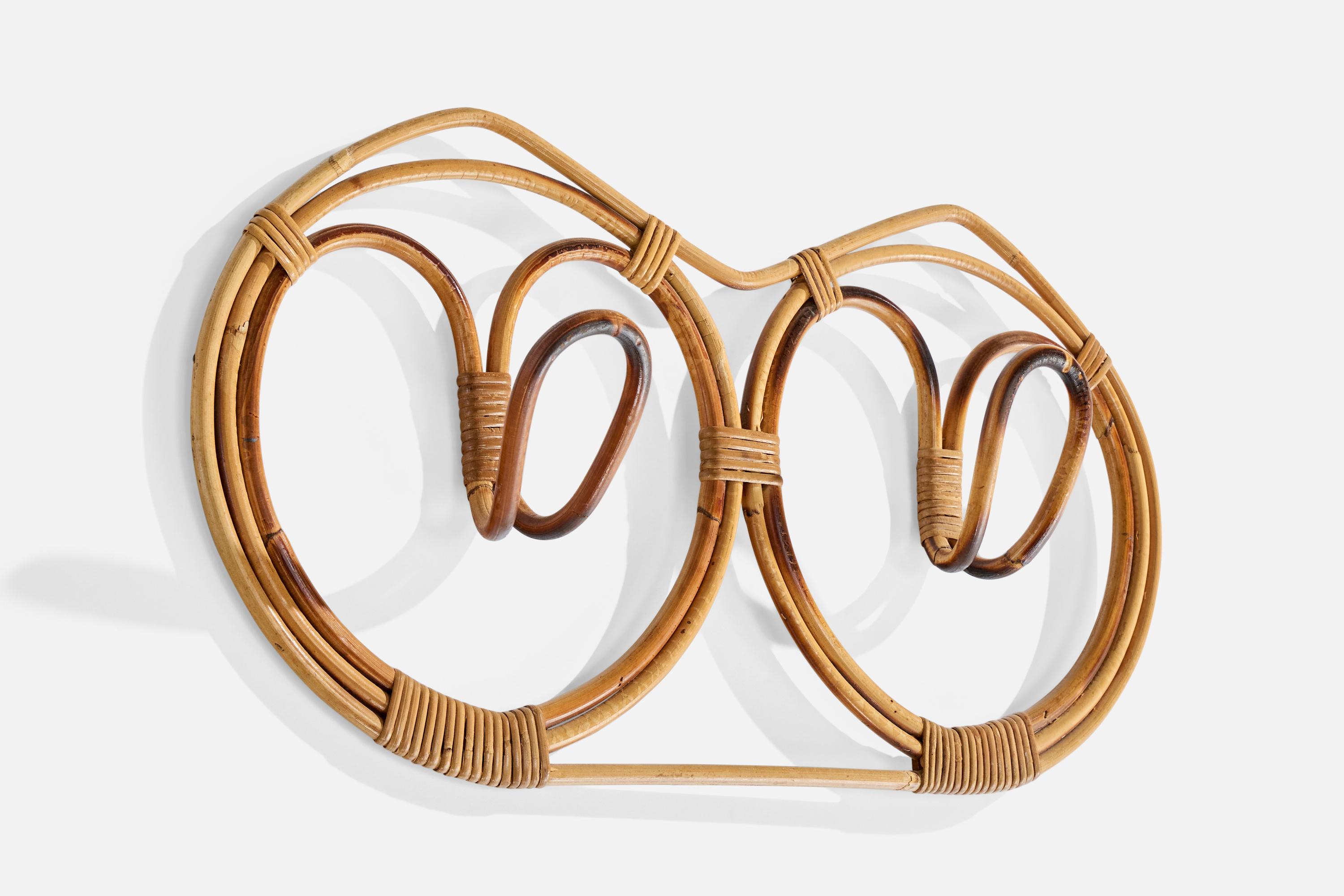 A moulded bamboo and rattan coat rack designed and produced in Italy, c. 1960s.

Wear consistent with age and use

Overall Dimensions (inches): 13.5
