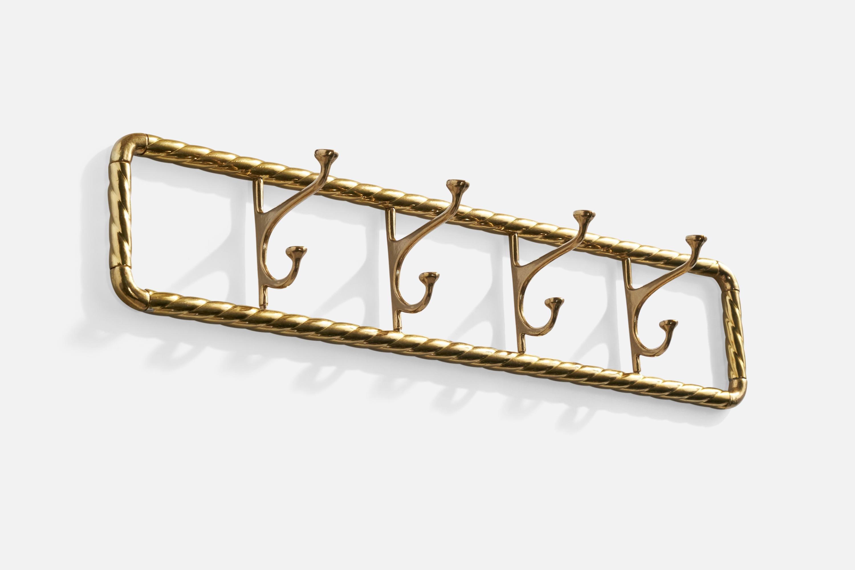 A brass wall rack designed and produced in Italy, c. 1940s.

Dimensions: 5” H x 23.375” W x 4” D

Four hooks