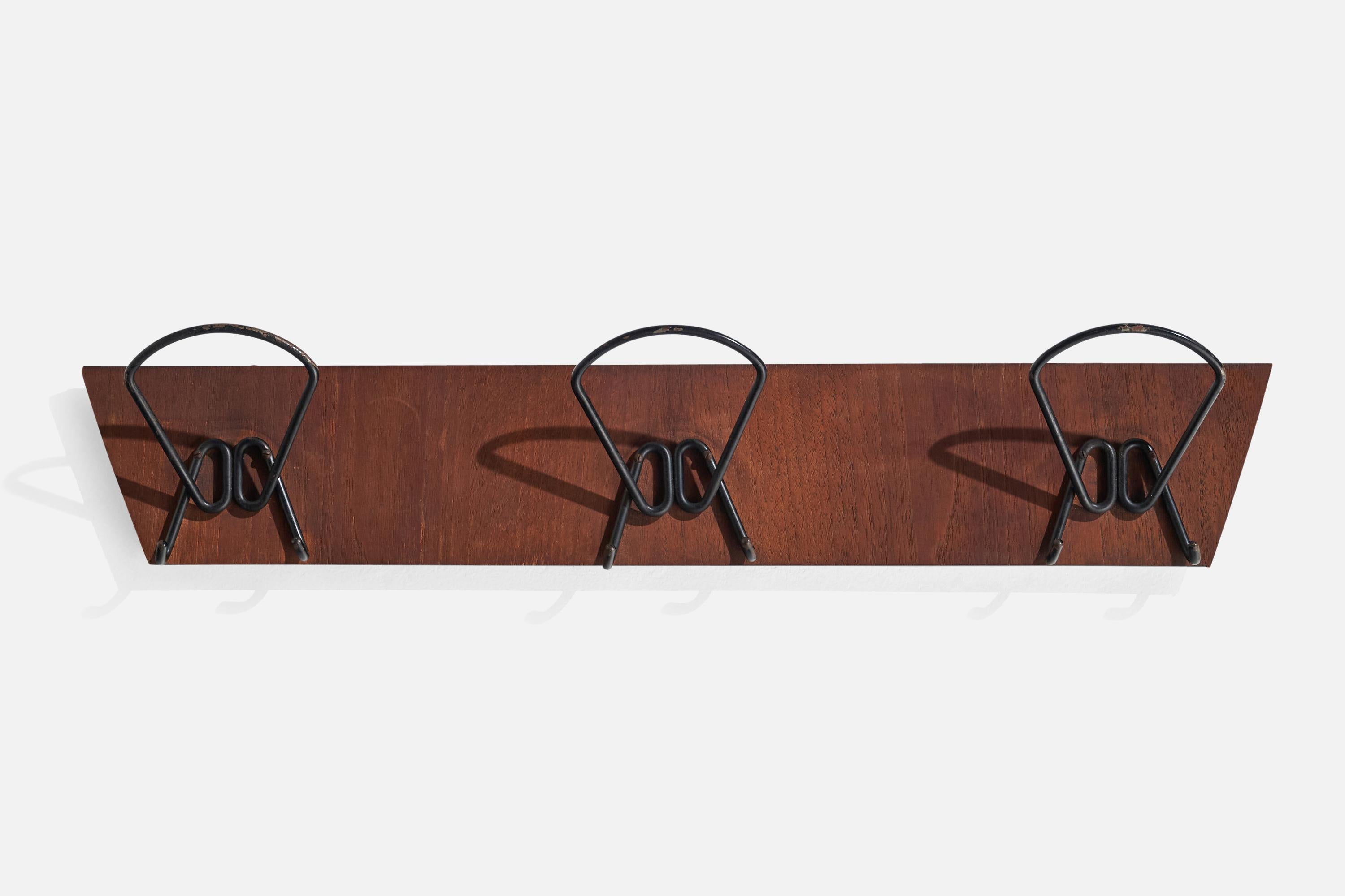 A teak and black-lacquered metal coat rack designed and produced in Italy, 1940s.