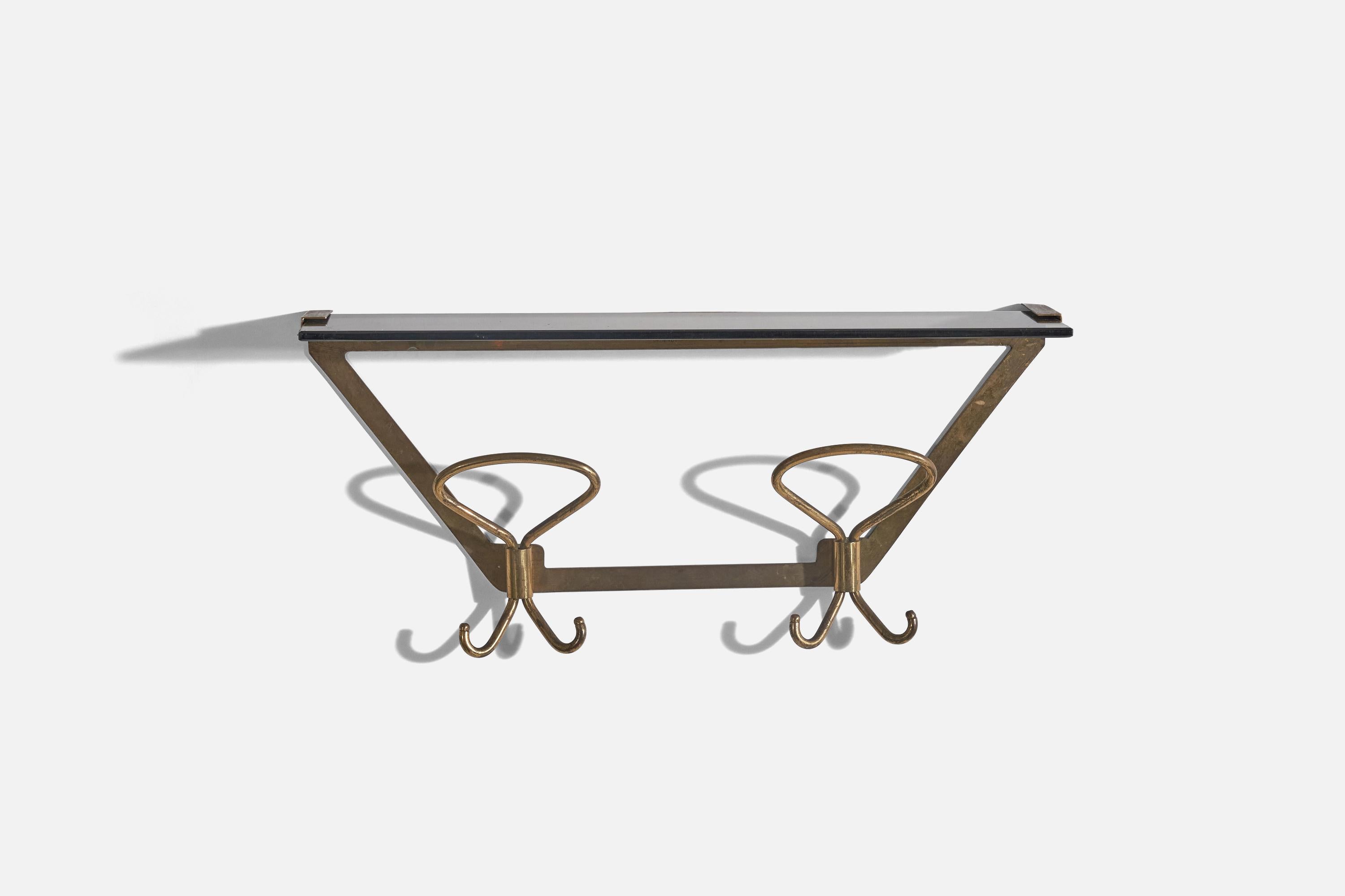 A brass and glass coat rack with top shelf, designed and produced by an Italian designer, Italy, 1940s.