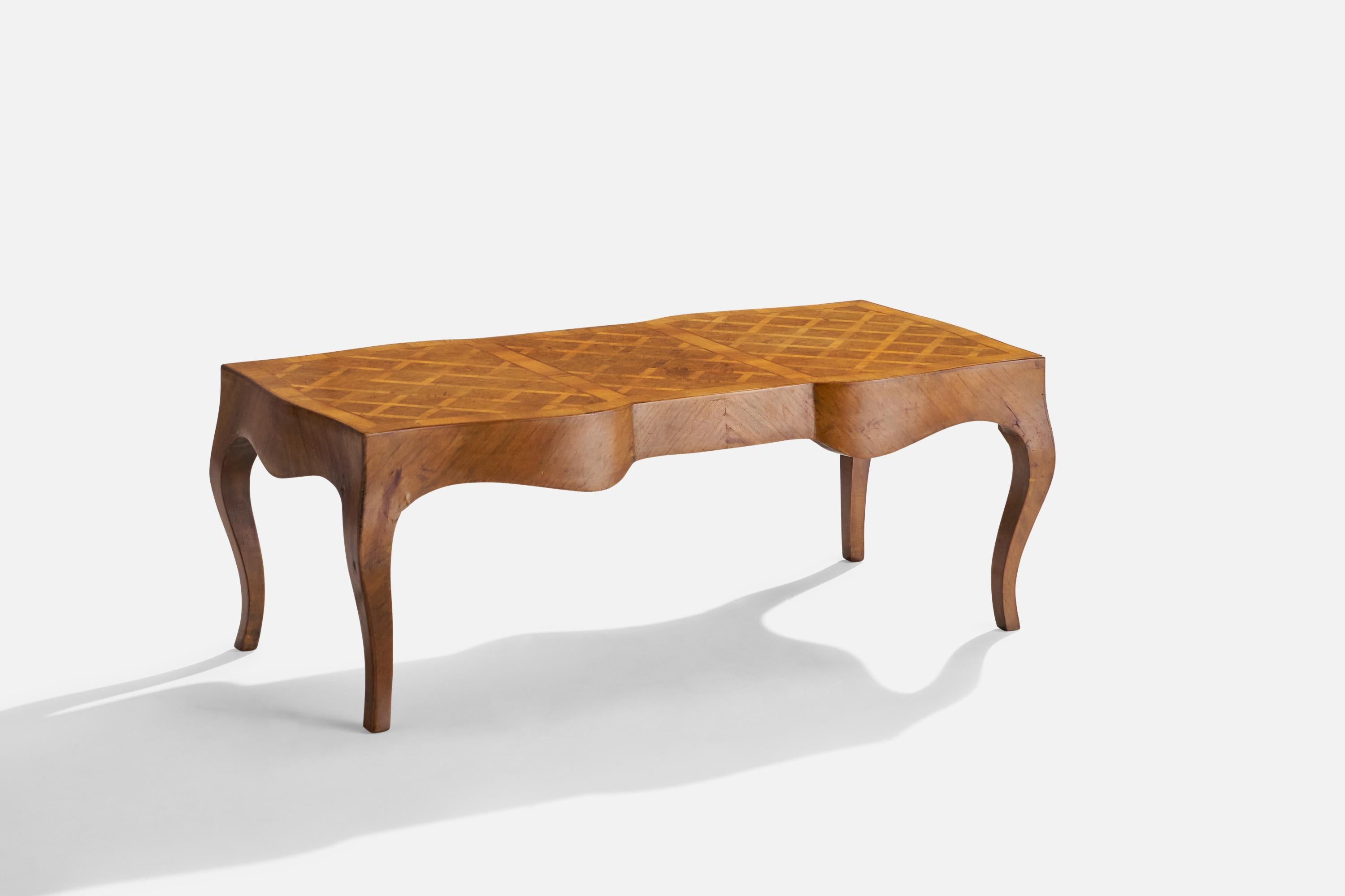 A walnut coffee table designed and produced in Italy, c. 1940s.