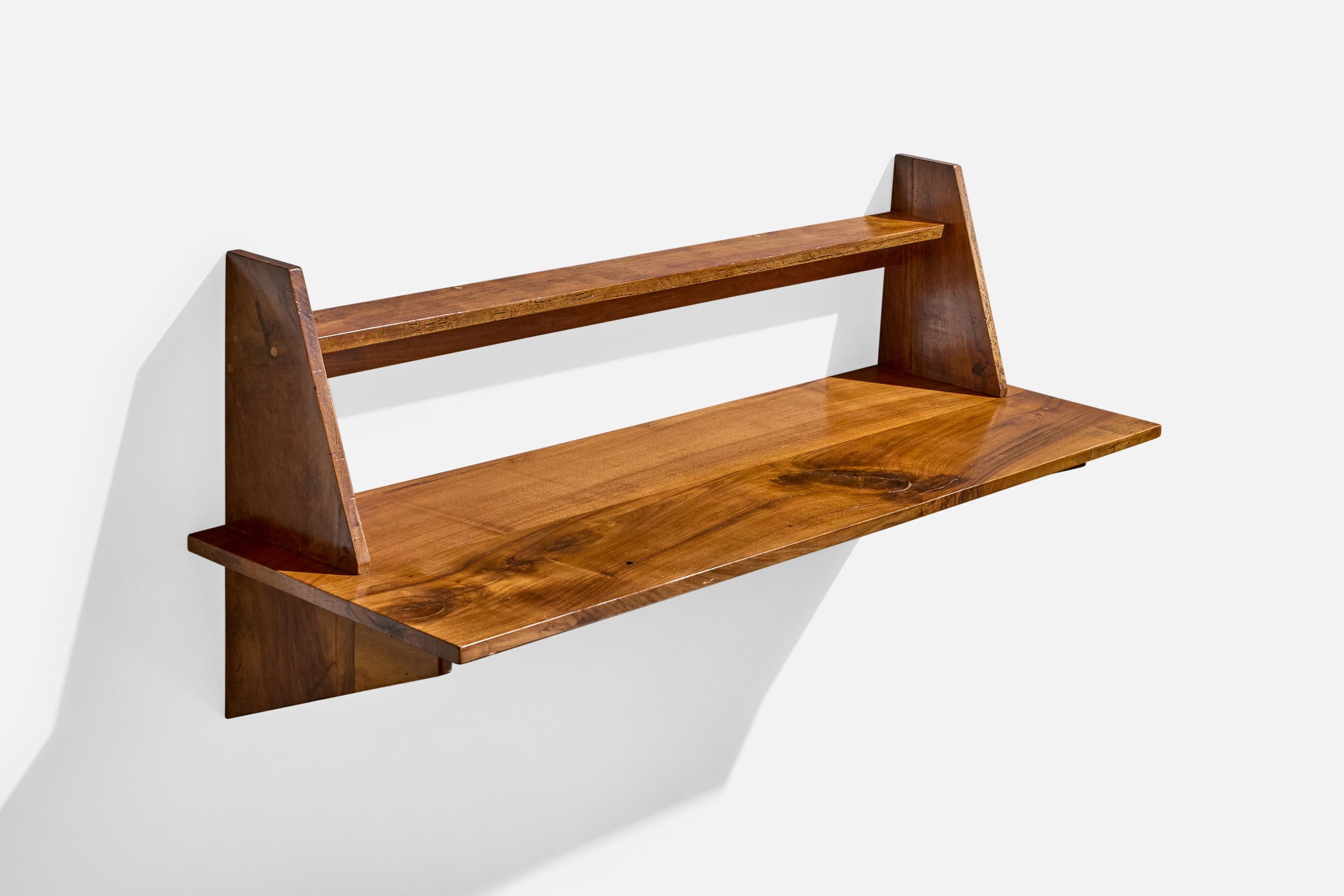 A walnut wall-mounted console table designed and produced in Italy, c. 1950s.

Overall Dimensions (inches): 20.5