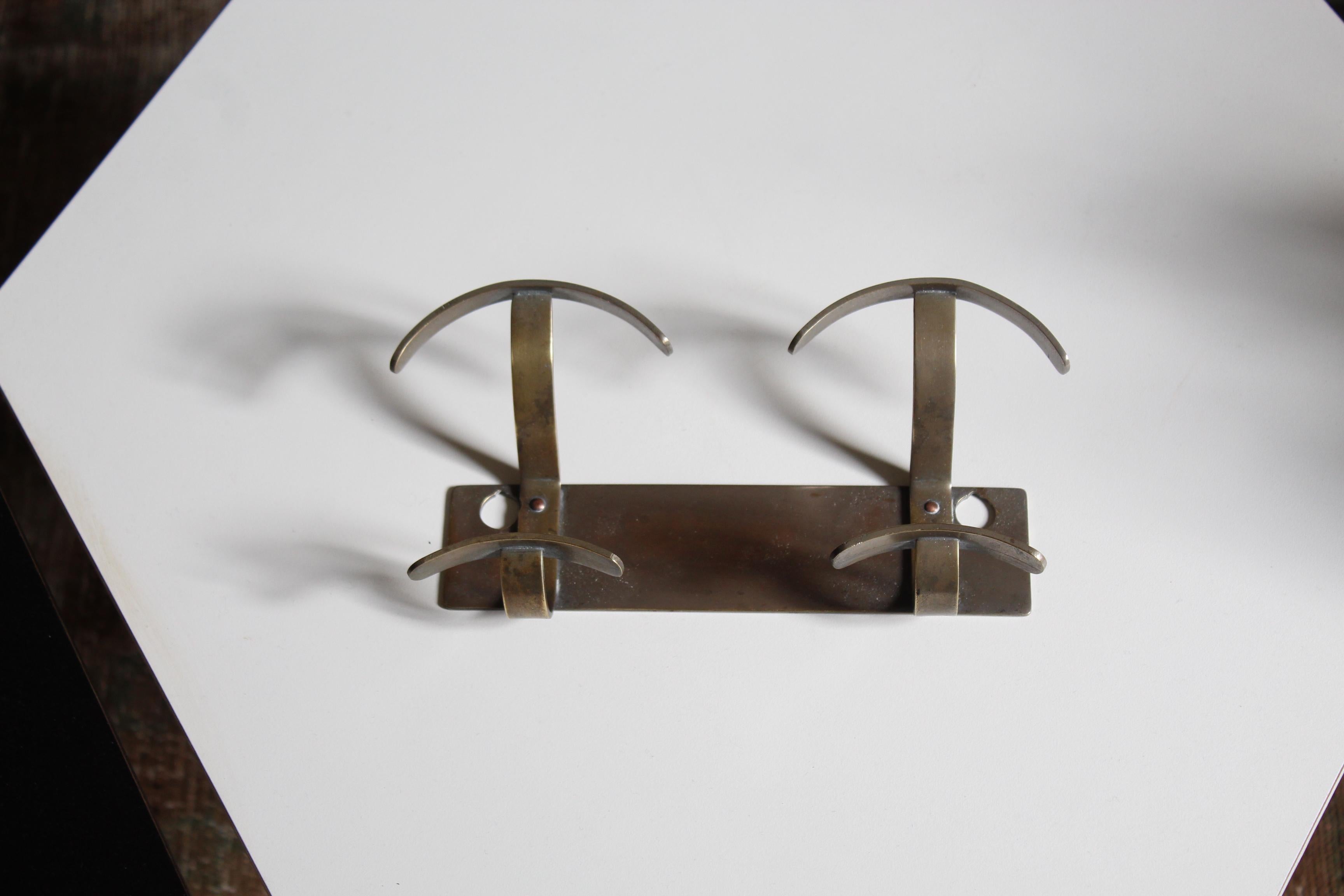 A double coat hanger / coat rack designed and produced in Italy, 1940s.