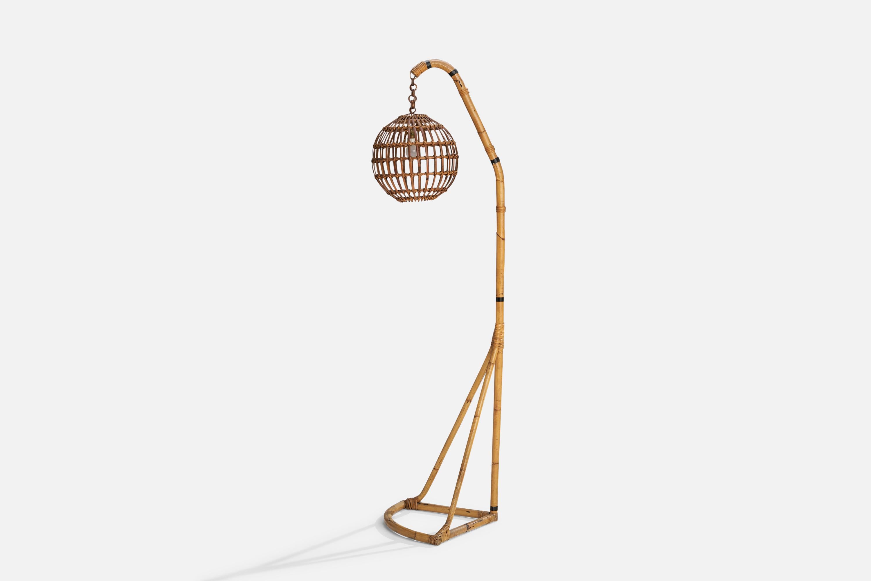 A sizeable bamboo and rattan floor lamp designed and produced in Italy, 1960s.

Overall Dimensions (inches): 79.53”  H x 16.75”  W x 22.45” D
Stated dimensions include shade.
Bulb Specifications: E-26 Bulb
Number of Sockets: 1
All lighting will be