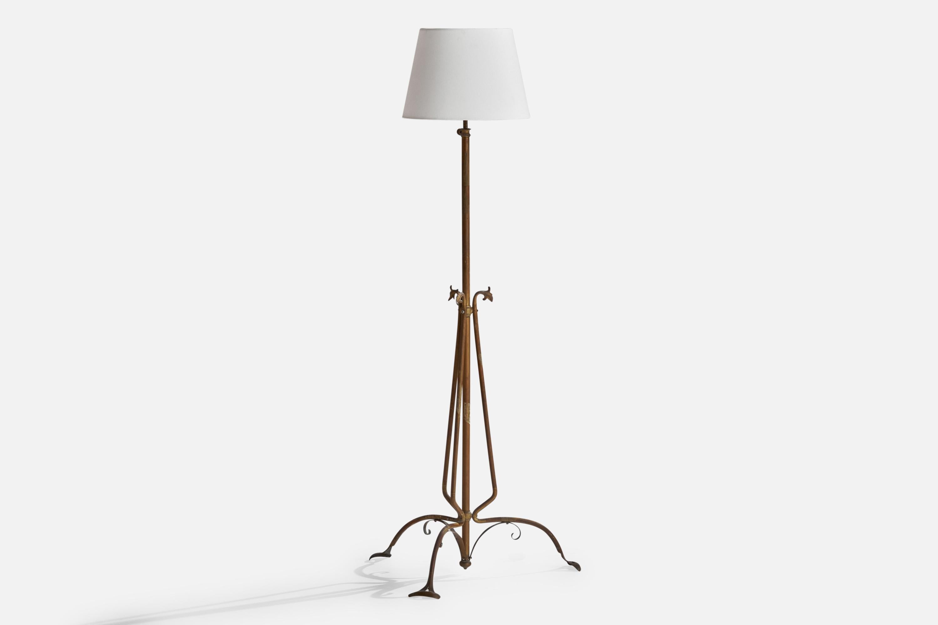 An adjustable brass and white fabric floor lamp designed and produced in Italy, c. 1910s.

Overall Dimensions (inches): 61” H x 22” W x 9” D
Stated dimensions include shade.
Bulb Specifications: E-26 Bulb
Number of Sockets: 3
All lighting will be