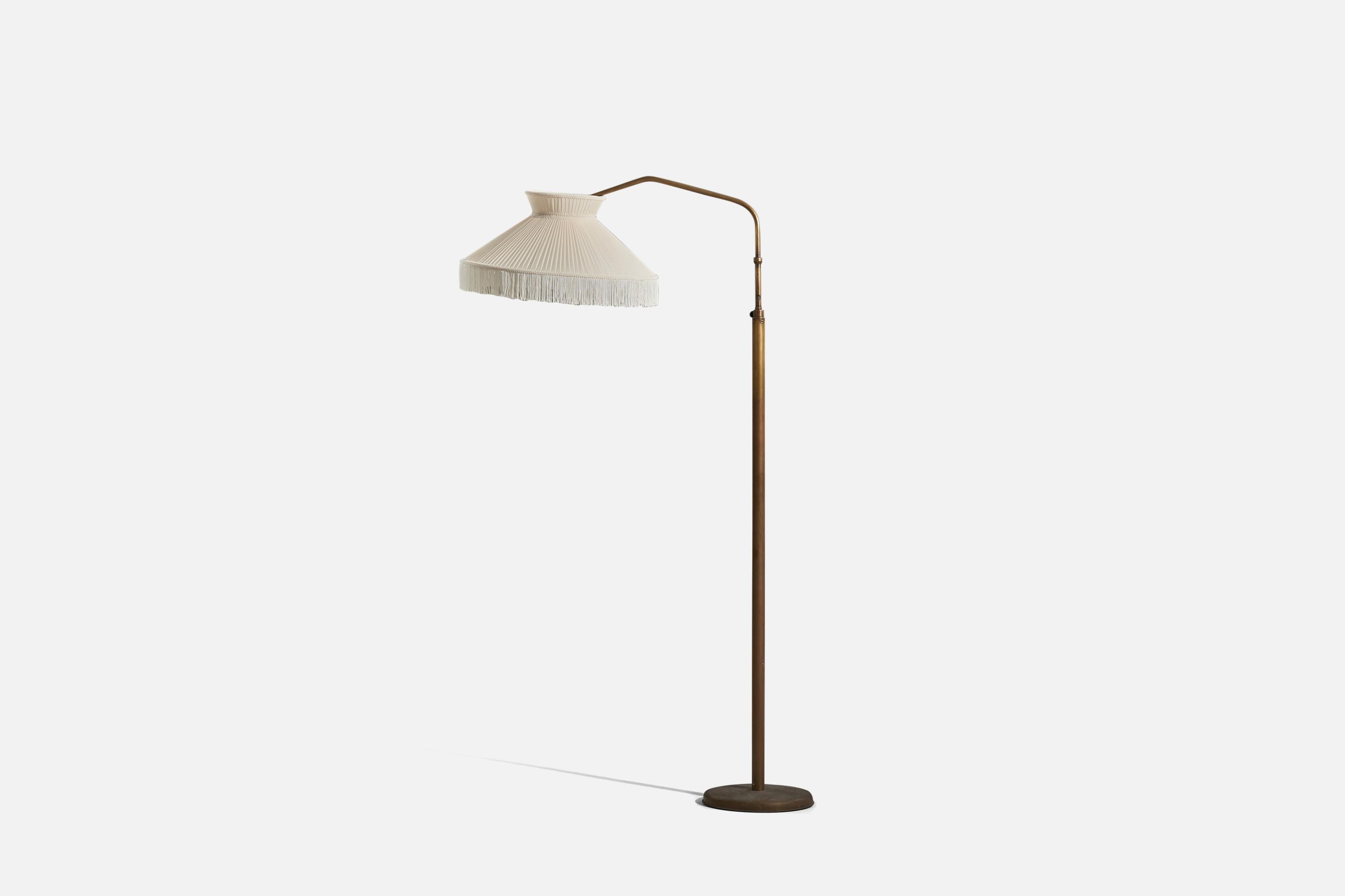 A brass and fabric floor lamp designed and produced in Italy, 1940s.

Variable dimensions, measured as illustrated in the first image.