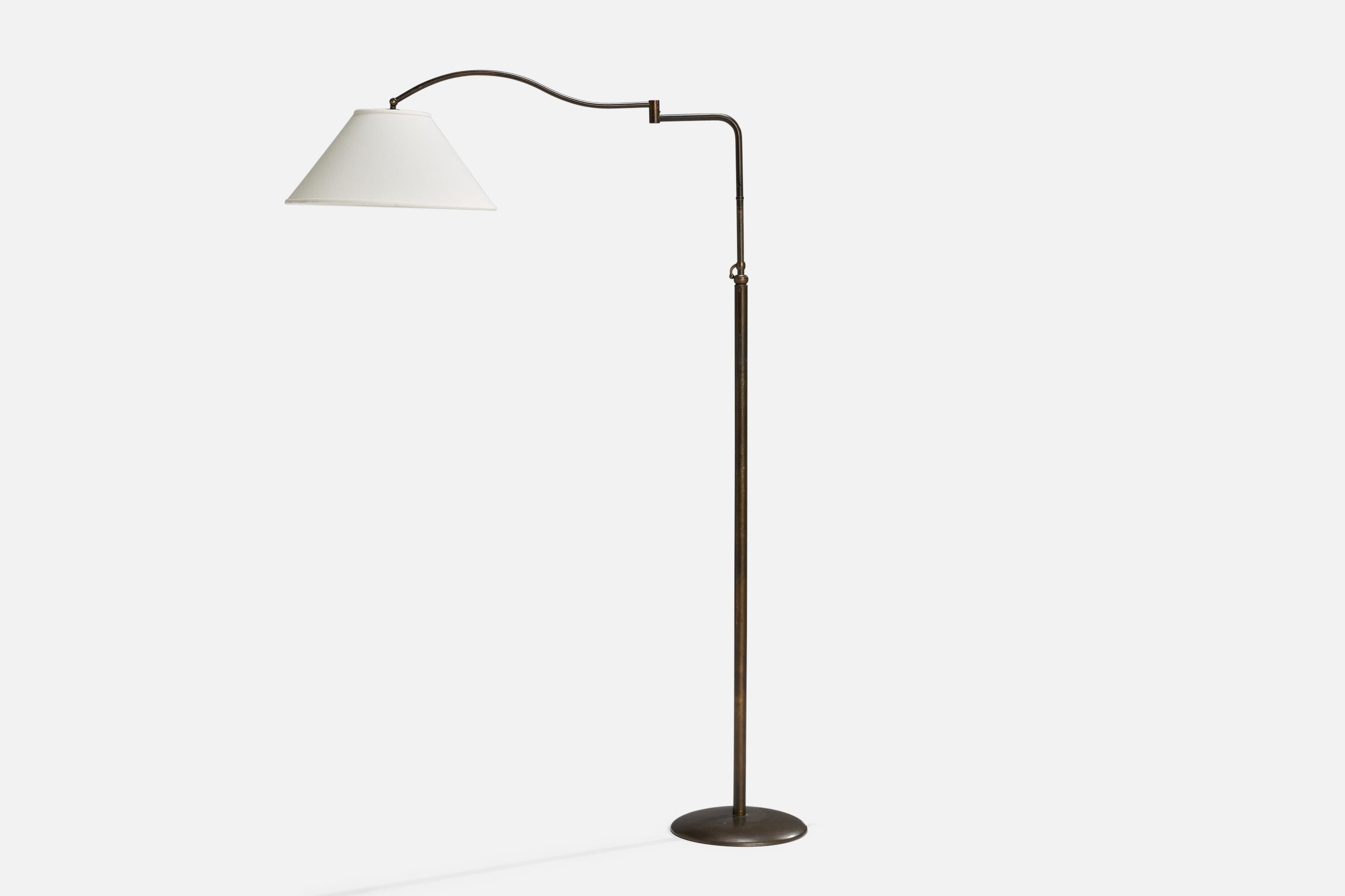 An adjustable brass and white fabric floor lamp designed and produced in Italy, 1940s.

Overall Dimensions (inches): 68” H x 18” W x 32” D
Stated dimensions include shade.
Bulb Specifications: E-26 Bulb
Number of Sockets: 1
All lighting will be