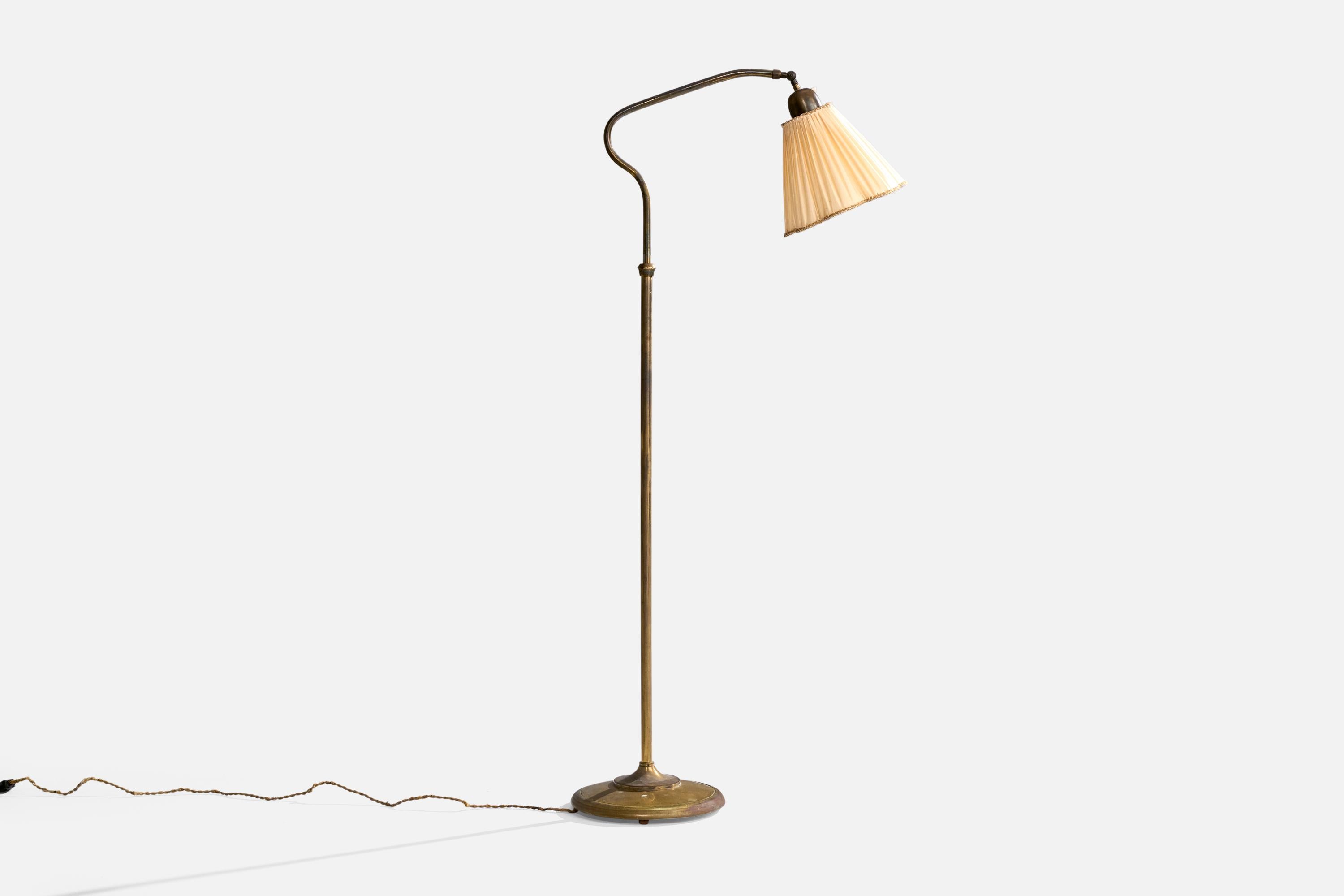 A brass and beige fabric floor lamp designed and produced in Italy, c. 1940s.

Presents with very dramatic oxidation. Vintage lampshade in fair condition.

Dimensions of Lamp with Shade (inches): 55.5“ H x 11.5“ W x 25“ D

Bulb Specifications: E-26
