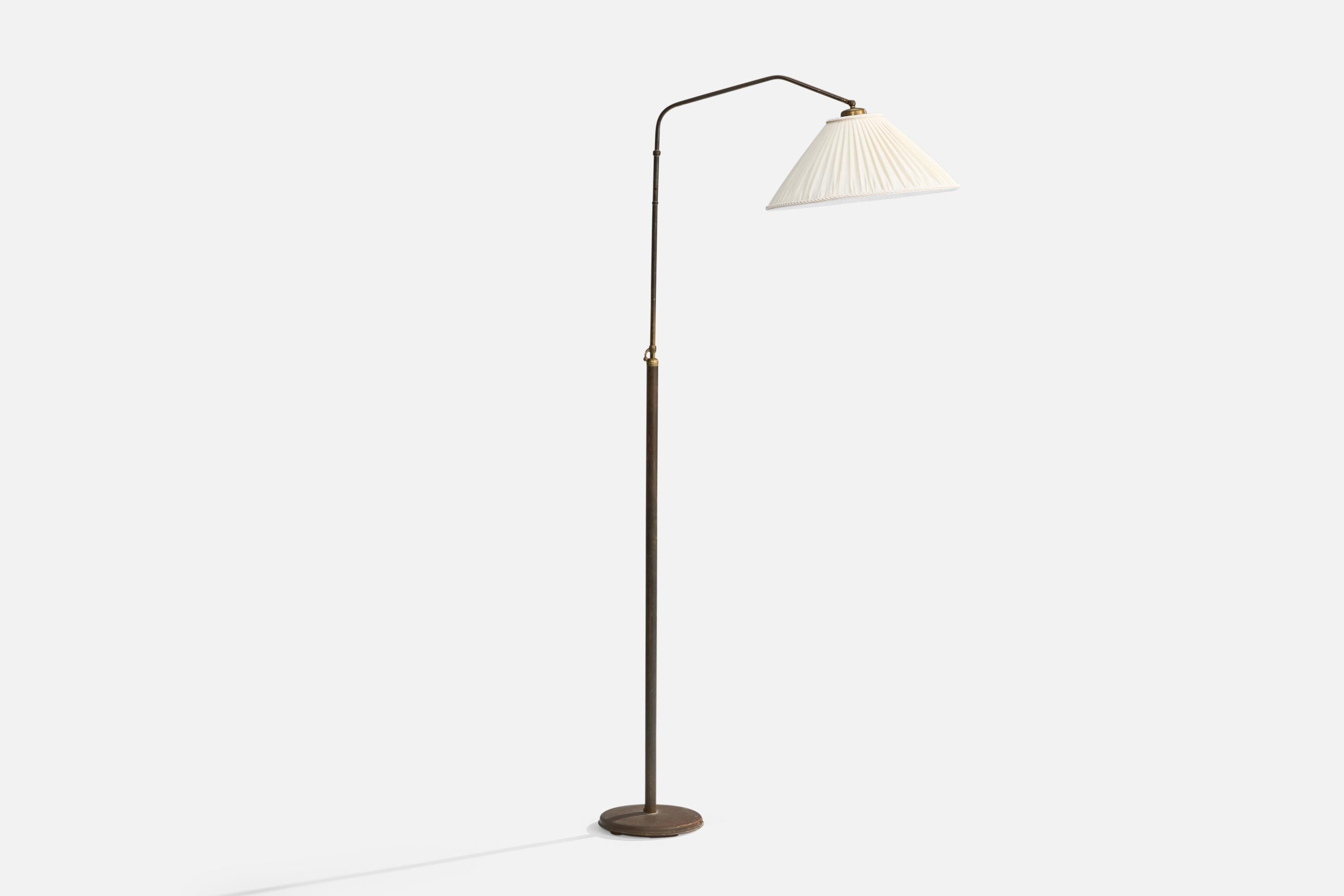 A brass and fabric floor lamp, designed and produced in Italy, 1940s.

Moderate oxidation present throughout lamp. Brand new lampshade.

Overall Dimensions: 72