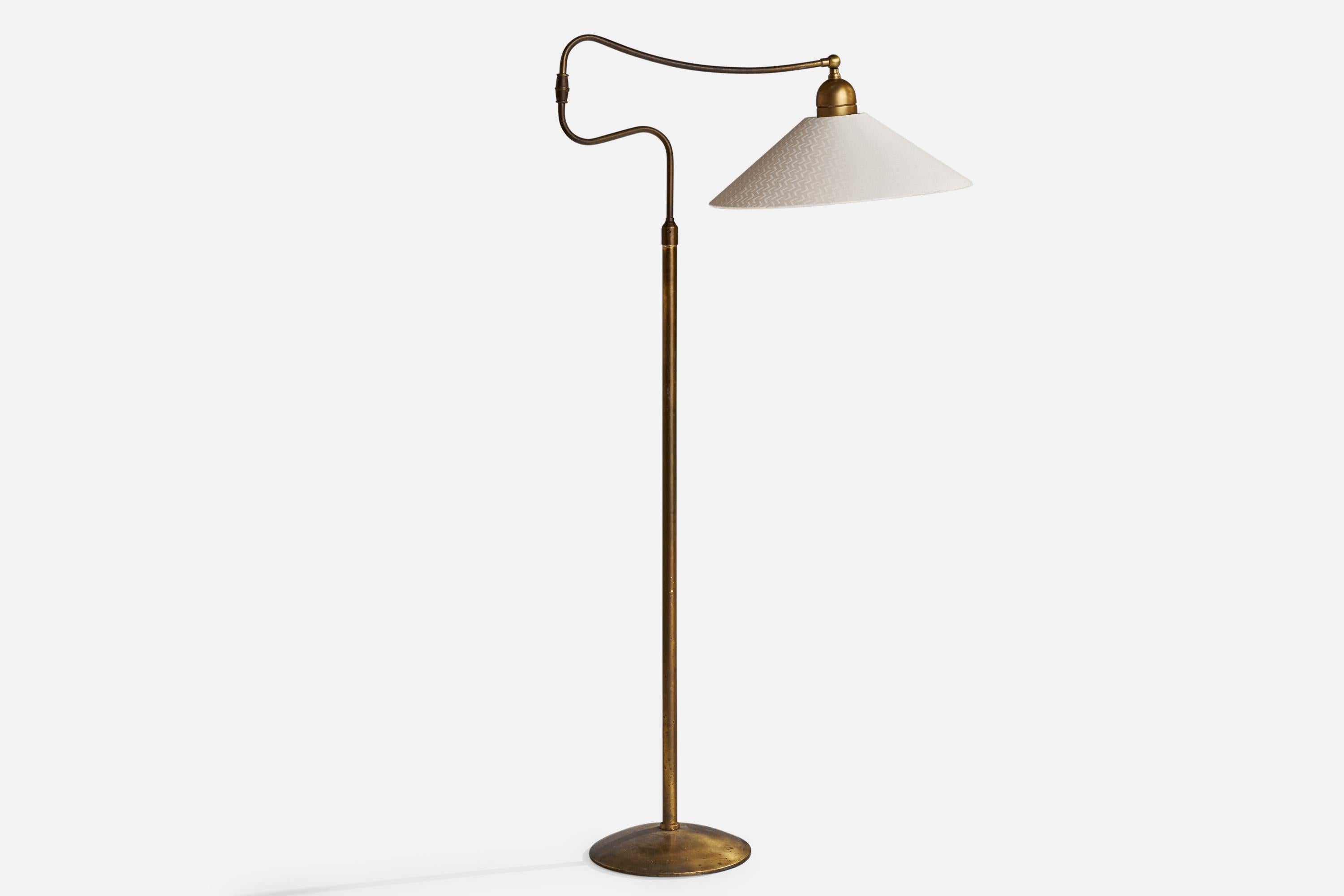 An adjustable brass and off-white fabric floor lamp designed and produced in Italy, c. 1950s.

Overall Dimensions (inches): 63.25” H x 33”W x 9” D
Stated dimensions include shade.
Bulb Specifications: E-26 Bulb
Number of Sockets: 1
All lighting will