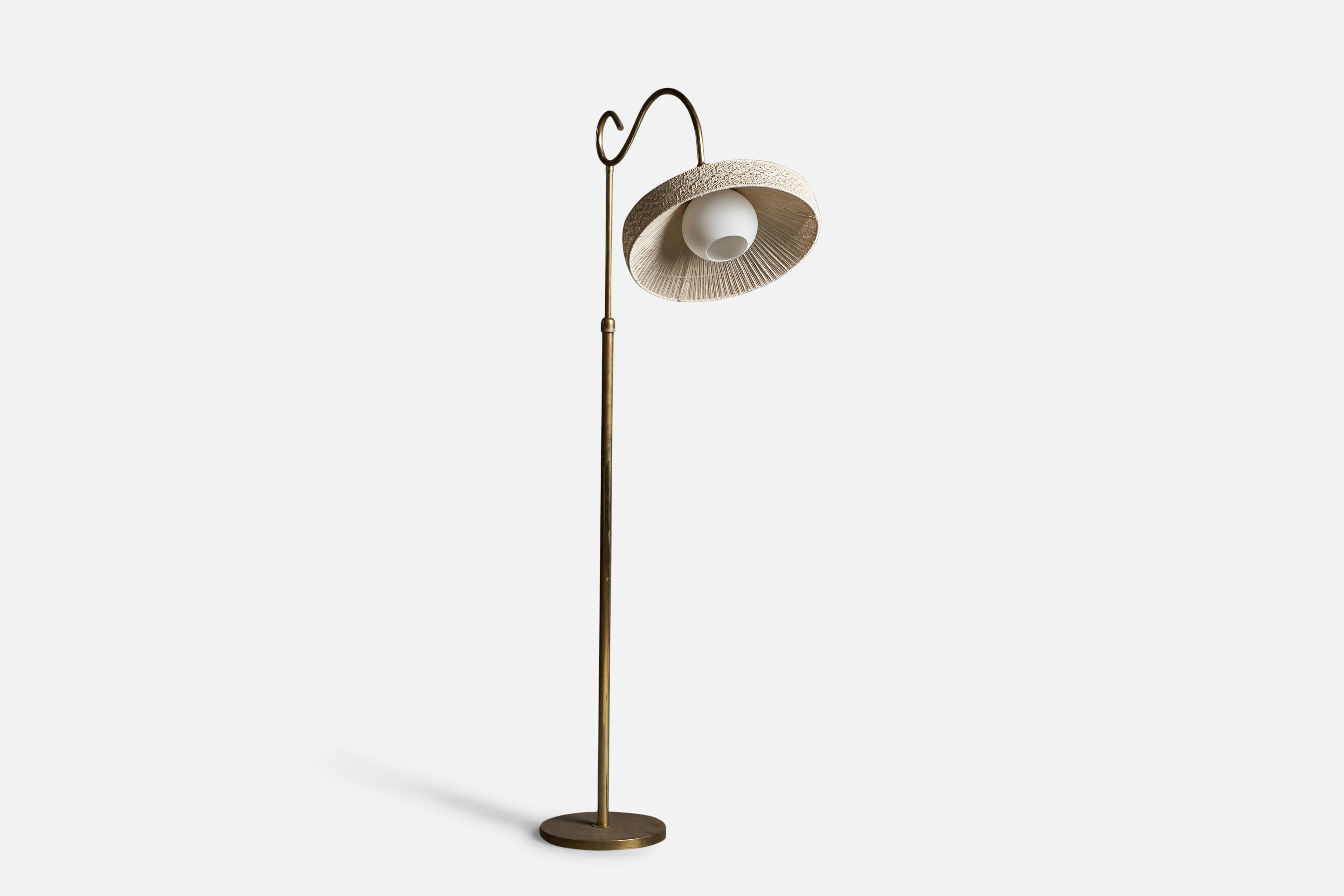An adjustable brass, Glass and fabric floor lamp designed and produced in Italy, 1940s.

Overall Dimensions: 59.15
