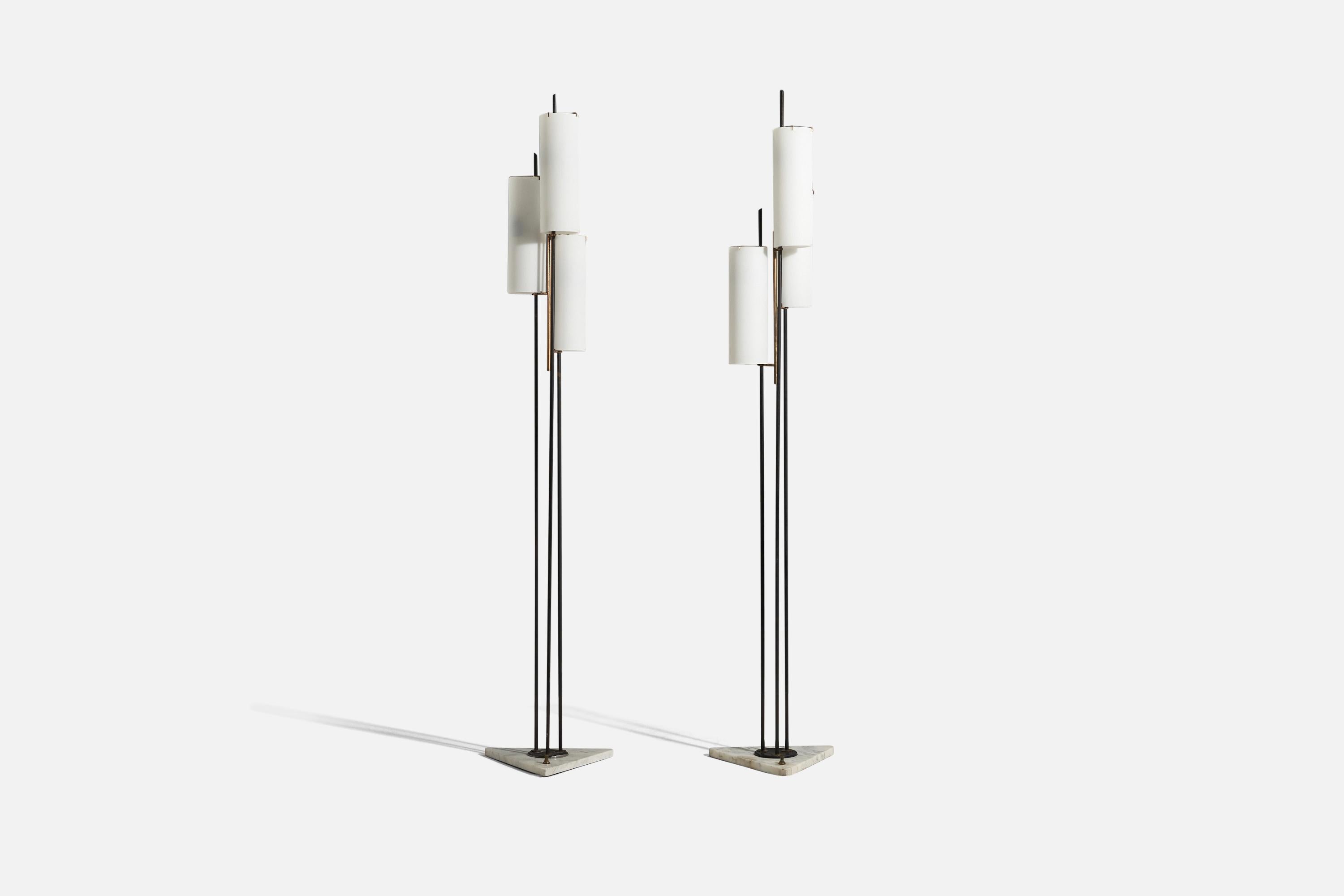 A pair of brass, glass, metal and marble floor lamps designed and produced in Italy, c. 1950s.

