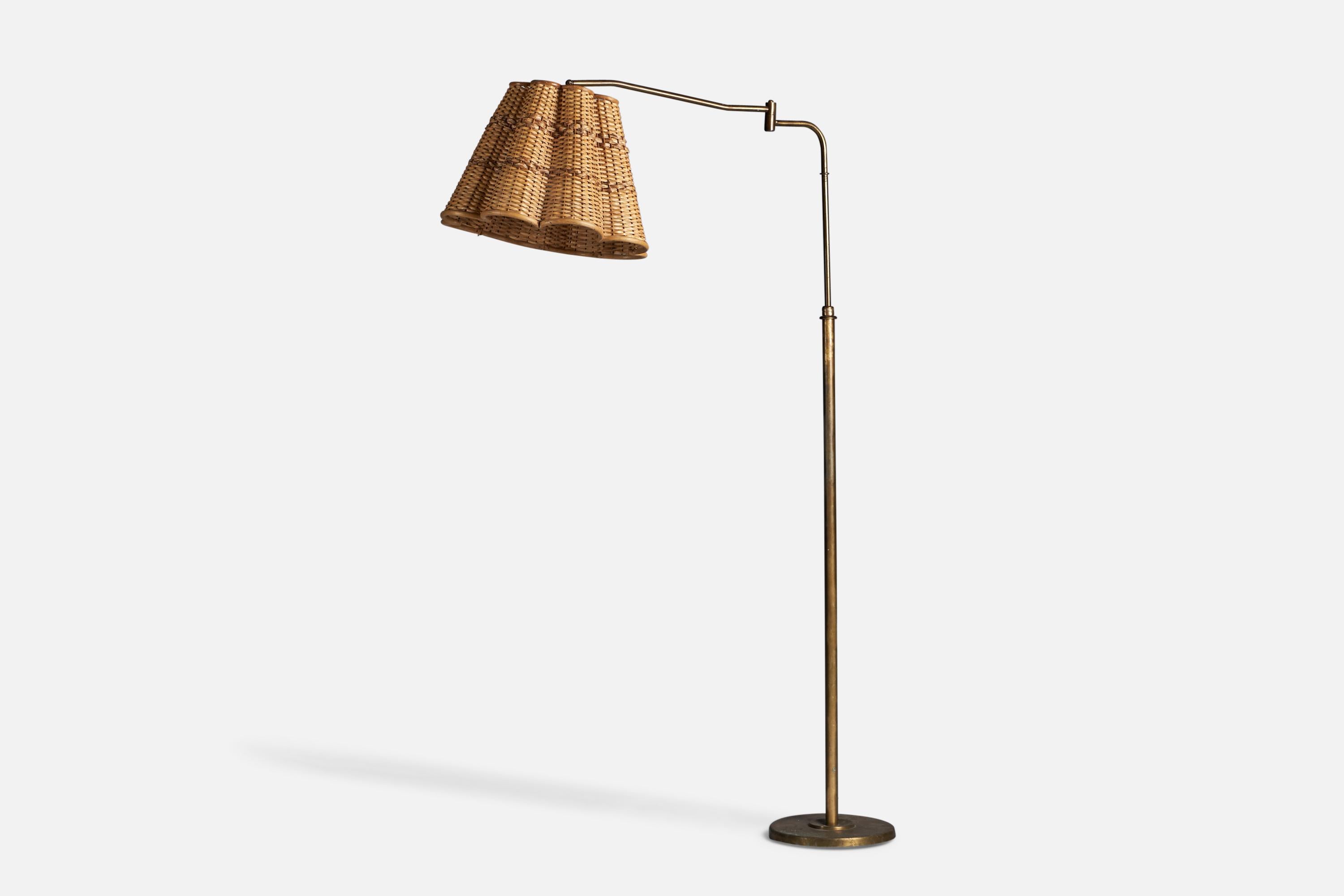 An adjustable brass and rattan floor lamp, designed and produced in Italy, 1940s.

Overall Dimensions (inches): 69.8