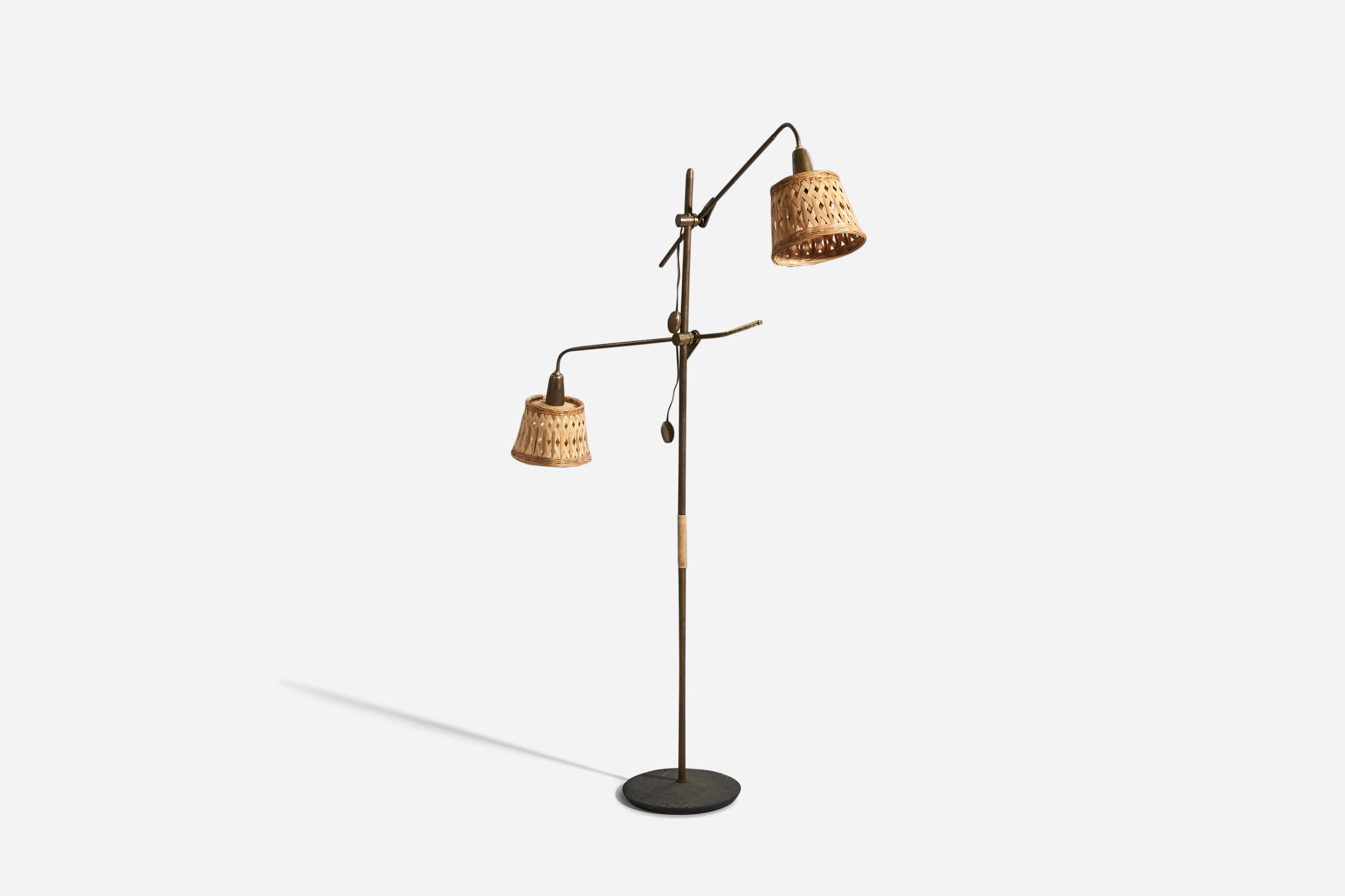 A brass and rattan floor lamp designed and produced in Italy, 1940s.

Sold with lampshade. 
Dimensions stated refer to the Floor Lamp with Shade.
 