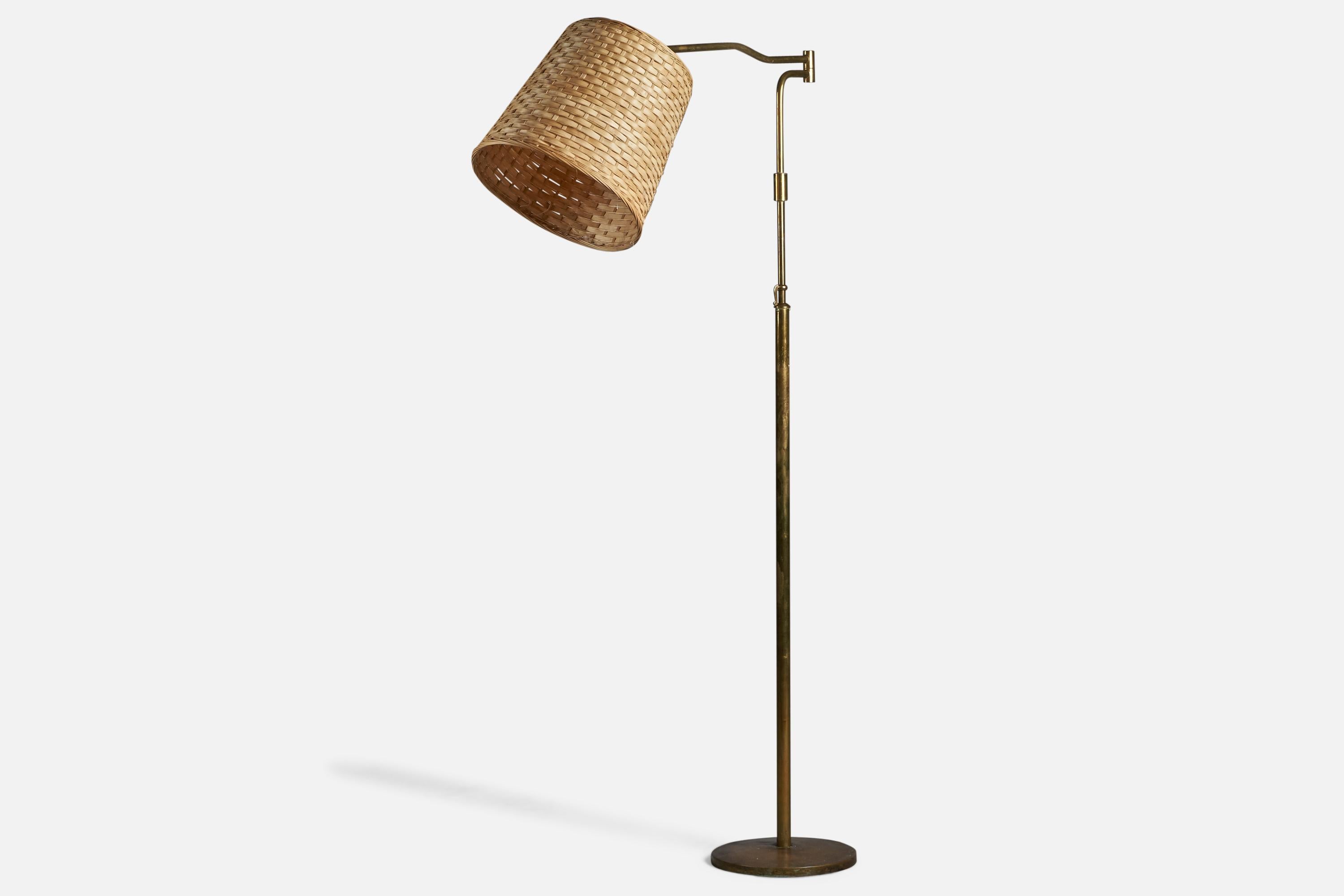 An adjustable brass and rattan floor lamp designed and produced in Italy, 1940s.

Overall Dimensions (inches): 68.5” H x 14.5” W x 40” D
Bulb Specifications: E-26 Bulb
Number of Sockets: 1
All lighting will be converted for US usage. We are unable