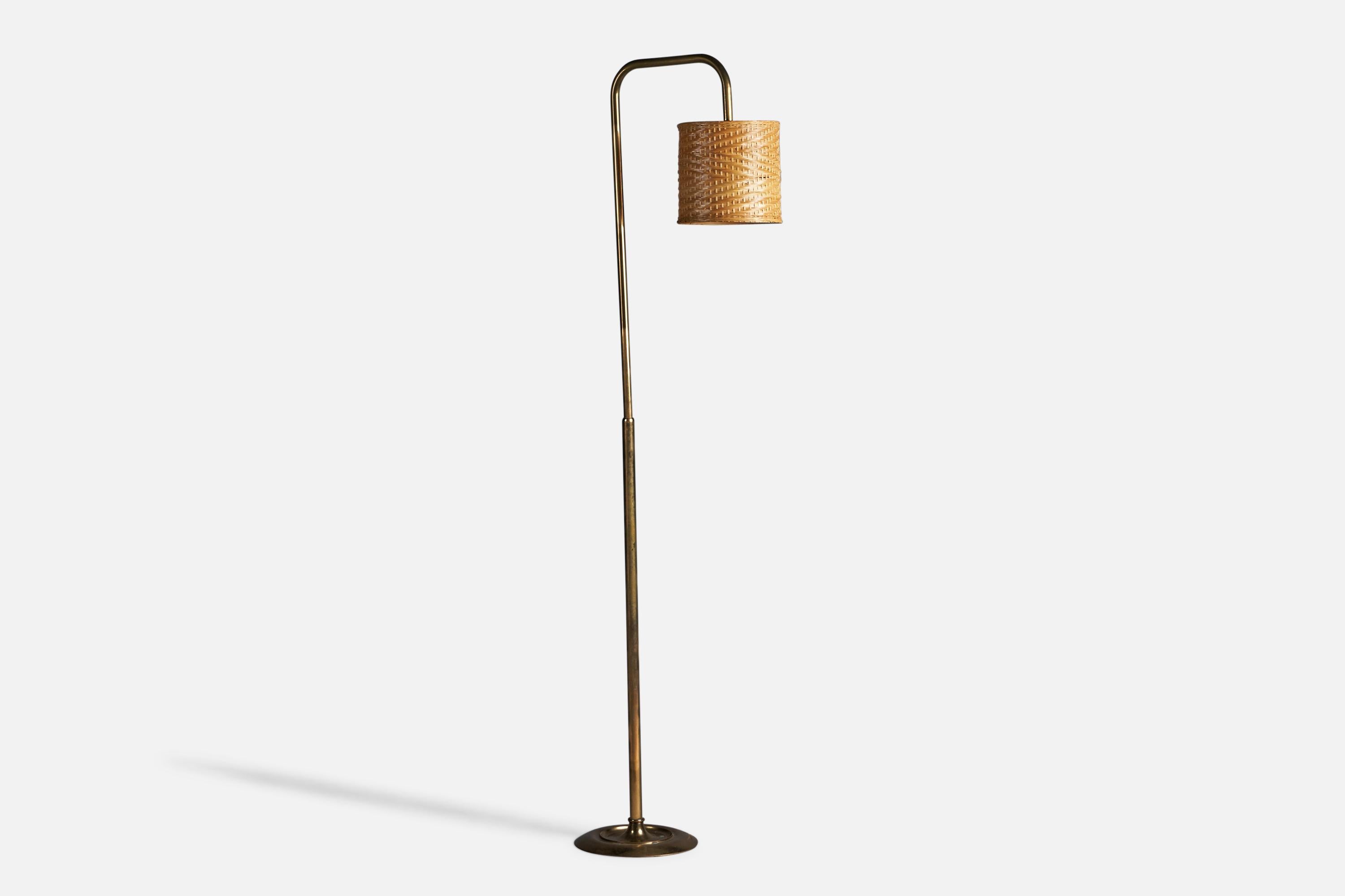 A brass and rattan floor lamp, designed and produced in Italy, c. 1960s.

Overall Dimensions (inches): 74.25