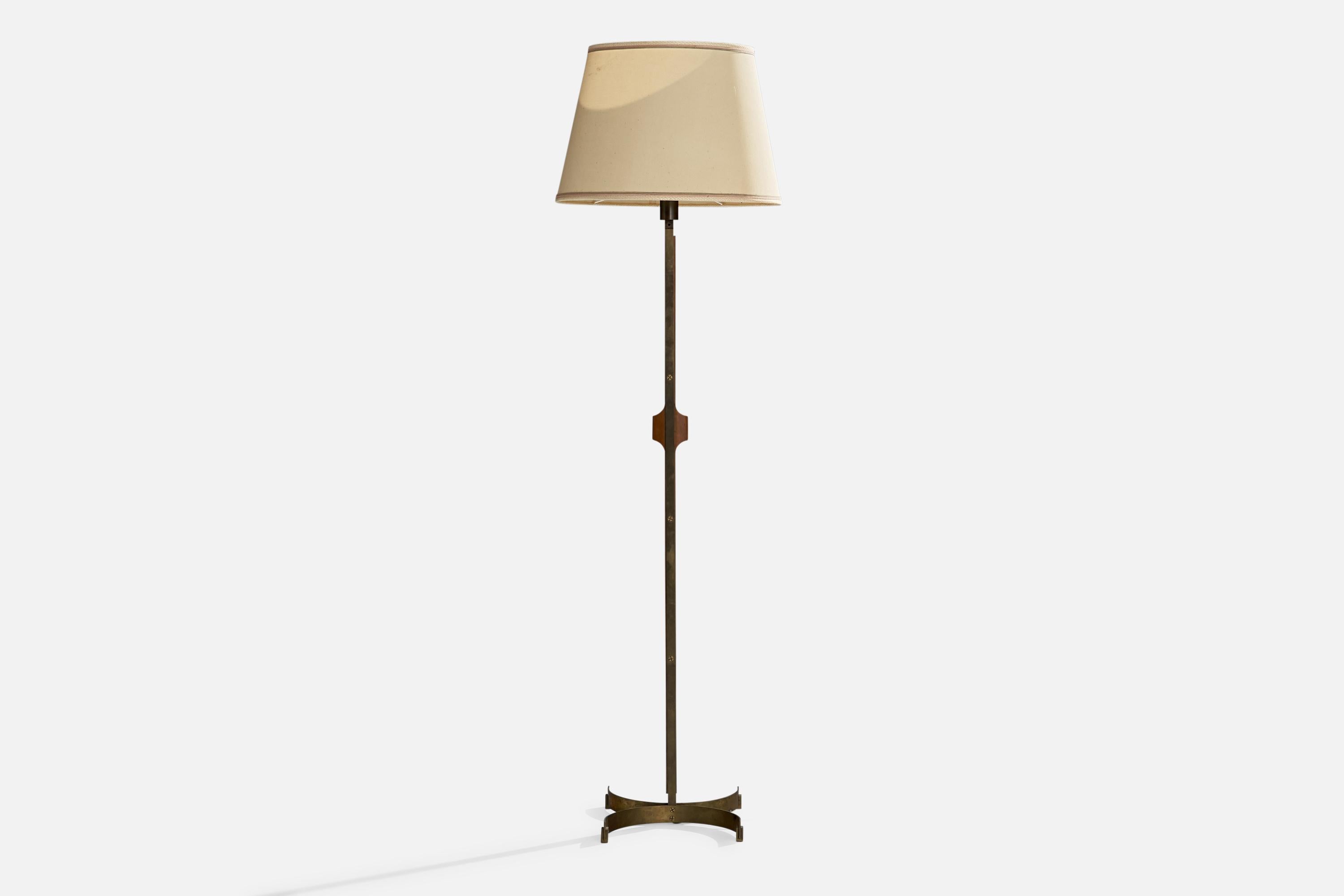A walnut, brass and beige fabric floor lamp designed and produced in Italy,c. 1940s.

Overall Dimensions (inches): 69.5”  H x 20.25” W x 15” D
Stated dimensions include shade.
Bulb Specifications: E-26 Bulb
Number of Sockets: 1
All lighting will be