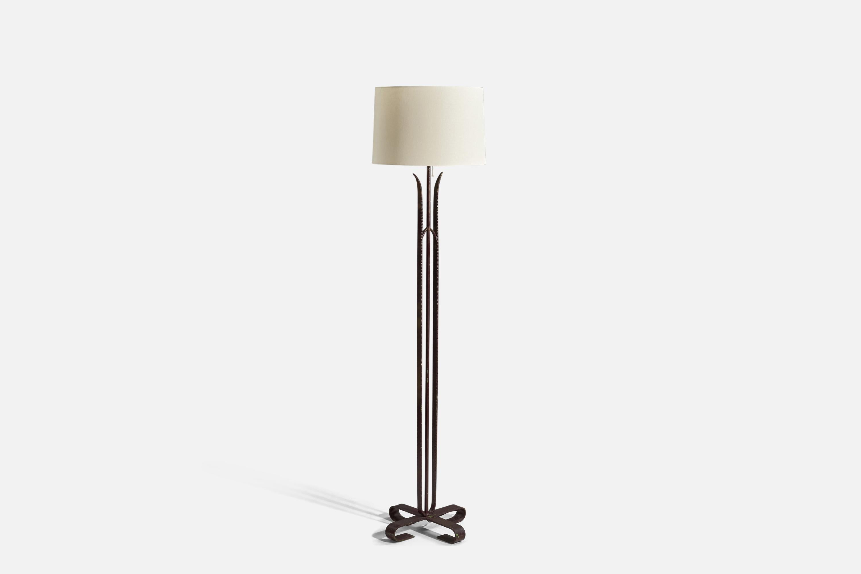 A black-lacquered iron and fabric floor lamp designed and produced in Italy, 1940s.

Sold with Lampshade(s). 
Stated dimensions refer to the Floor Lamp with the Shade(s). 

Socket takes standard E-26 medium base bulb.
There is no maximum