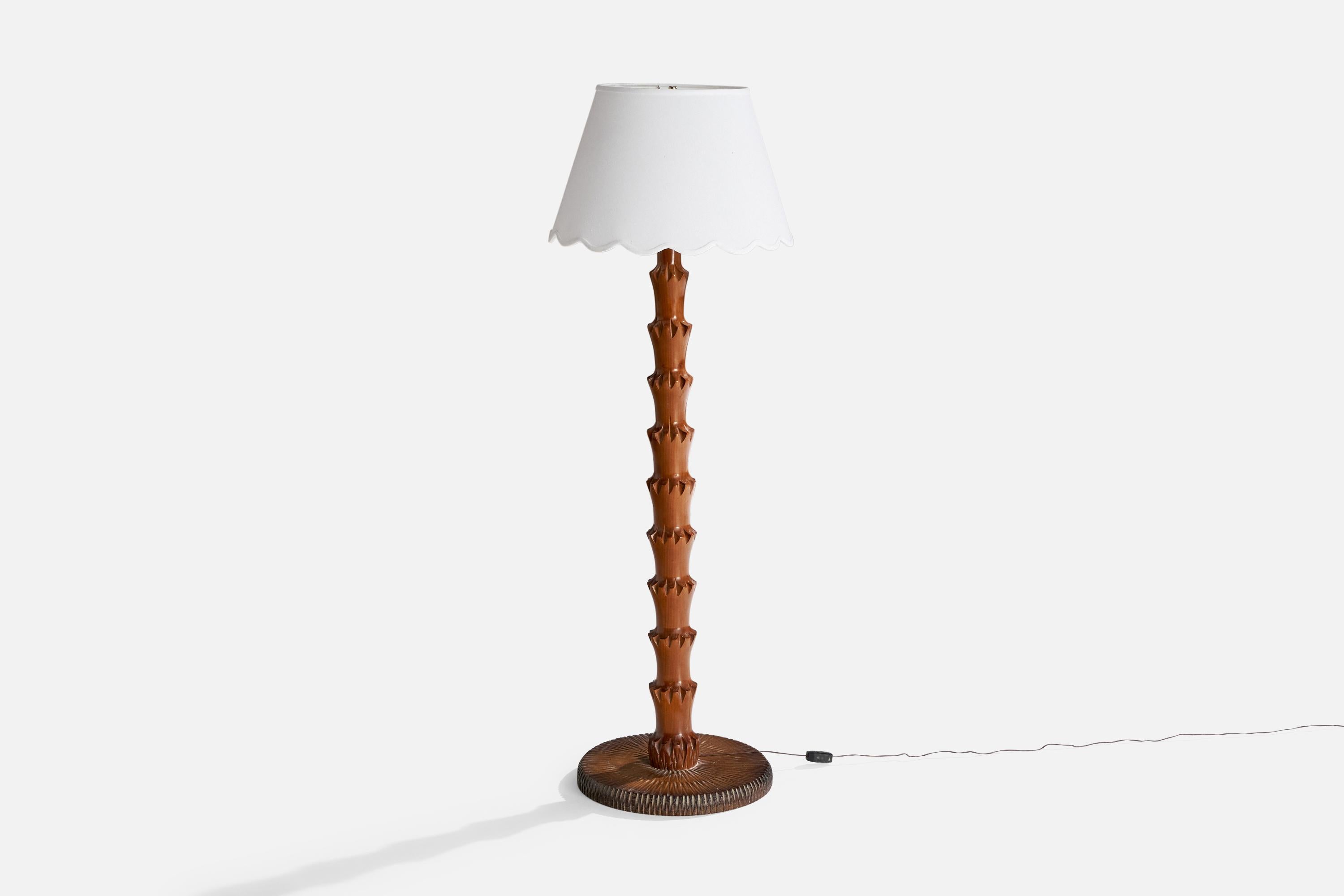 A dark-stained wood and fabric floor lamp designed and produced in Italy, c. 1960s.

Dimensions of Lamp with Shade (inches): 54.25“ H x 18.5“ Diameter

Bulb Specifications: E-26 Bulb

Number of Sockets (per fixture): 1

Sold with lampshade.

All
