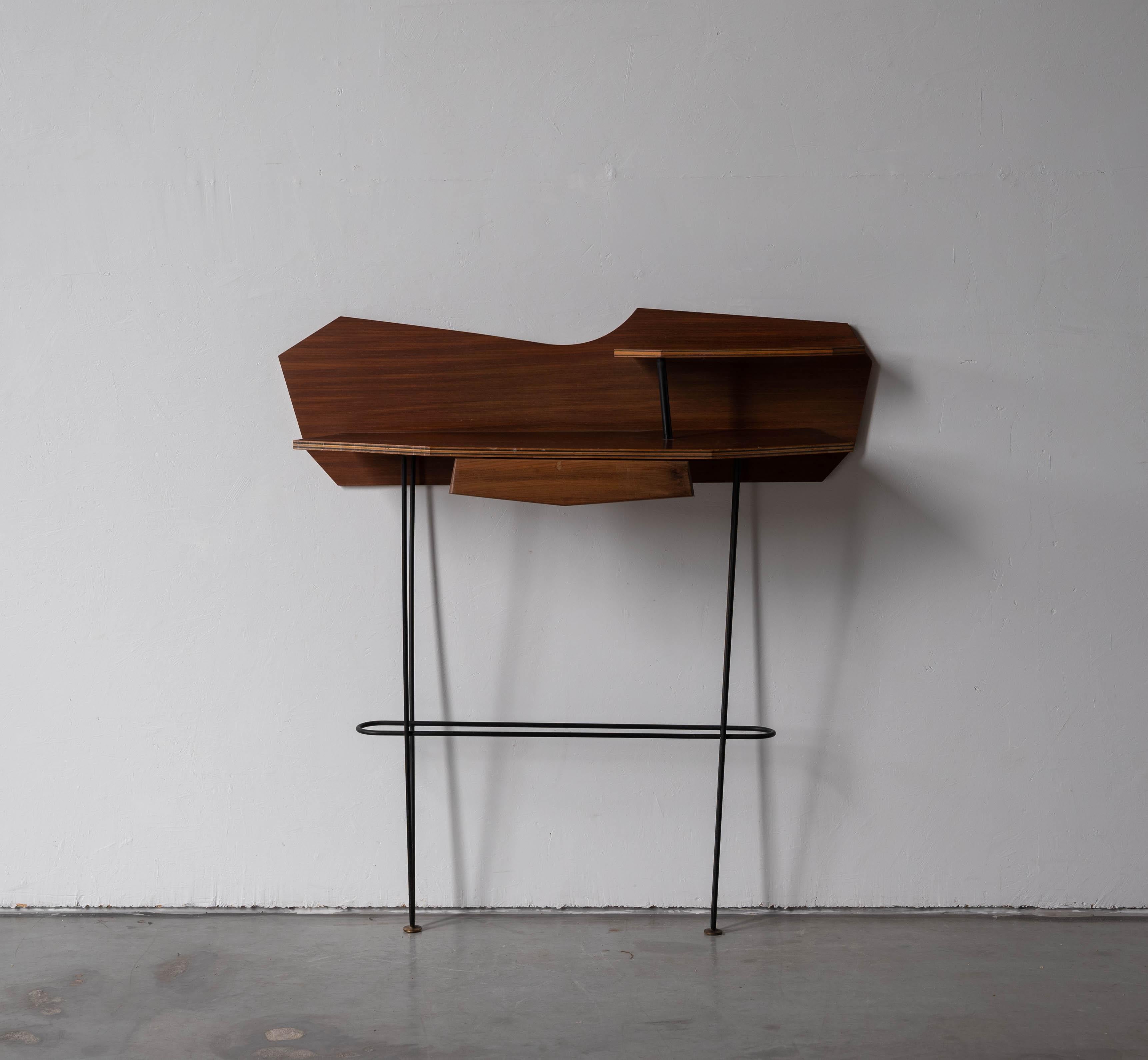 A plywood and black-lacquered metal console designed and produced in Italy, 1950s.


