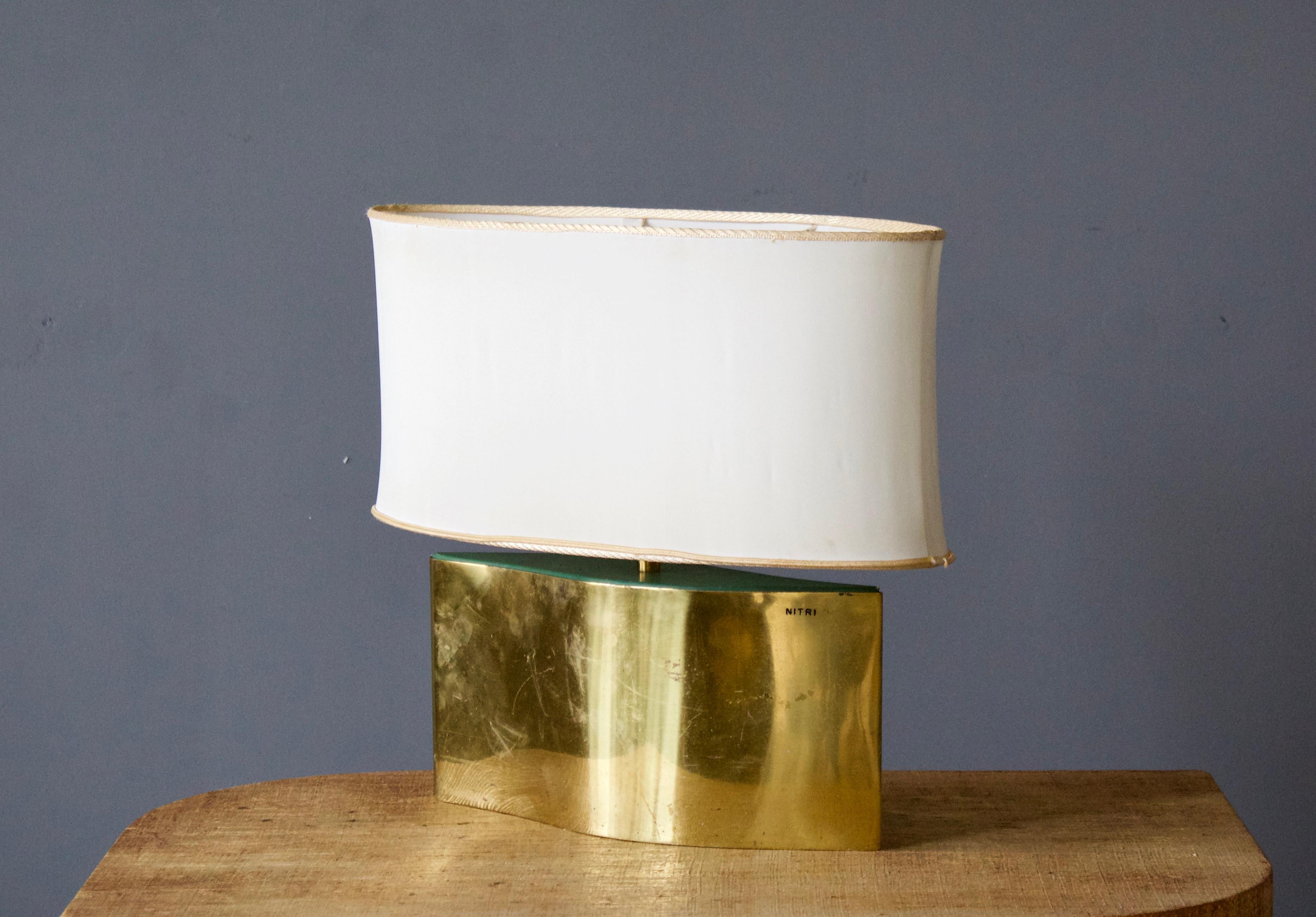 A table lamp, produced in Italy, 1960s. Brass, green acrylic and original fabric lampshade. Stamped 