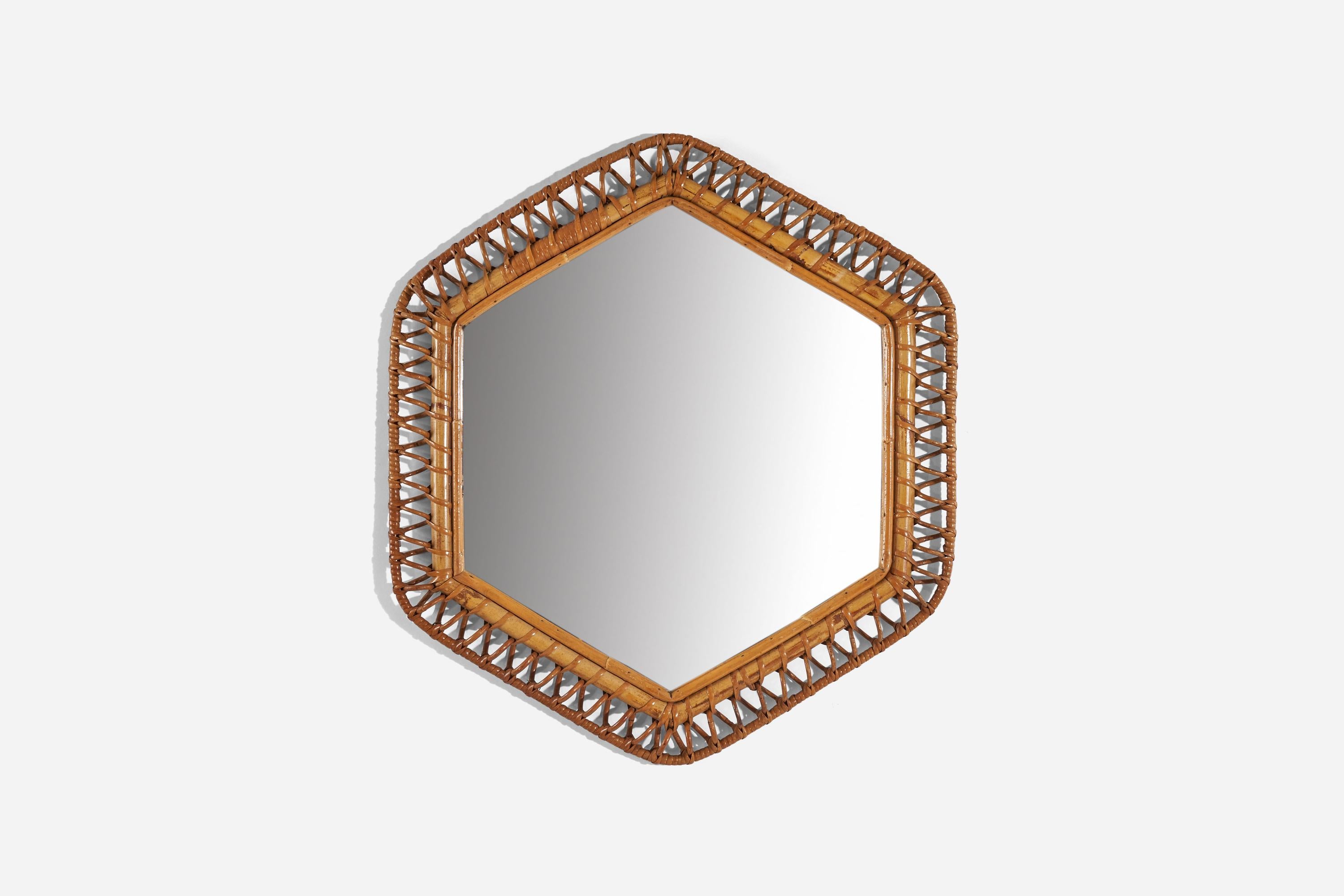 An hexagonal, rattan wall mirror designed and produced by an Italian designer, Italy, 1950s-1960s.
    