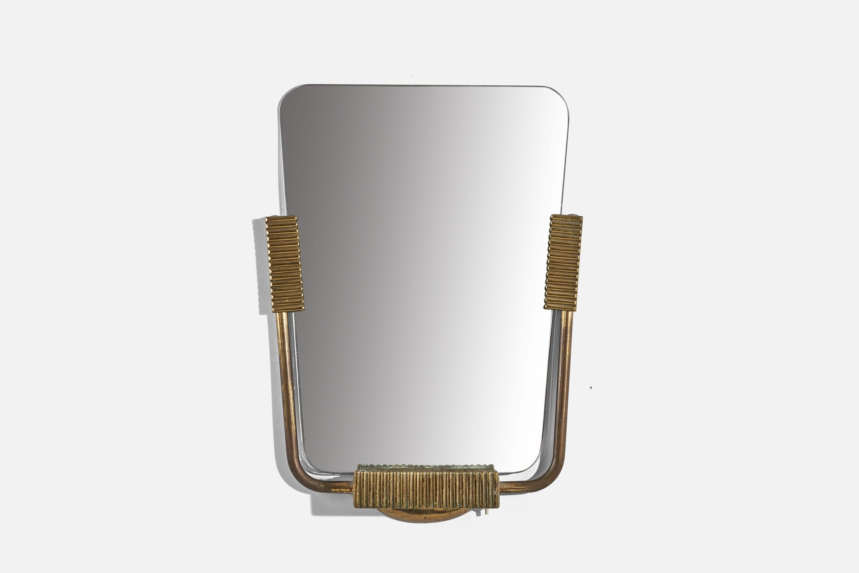 A brass, illuminated wall mirror designed and produced by an Italian designer, Italy, 1940s.
 